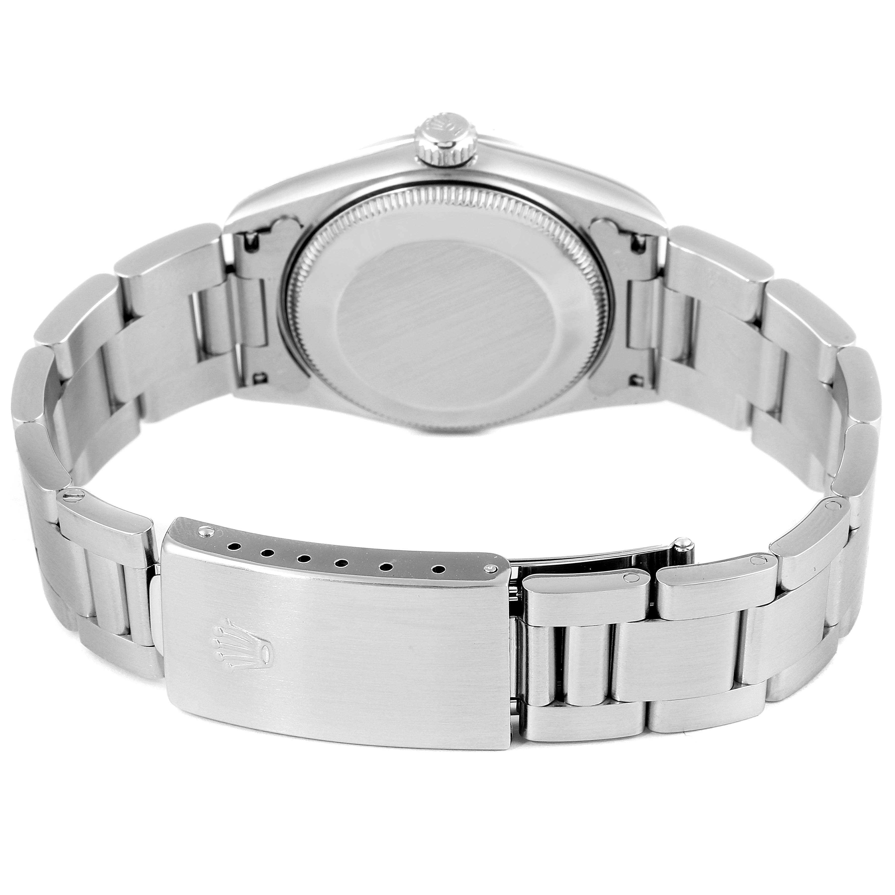 This image shows the backside and clasp of a Mid-Size Rolex watch.