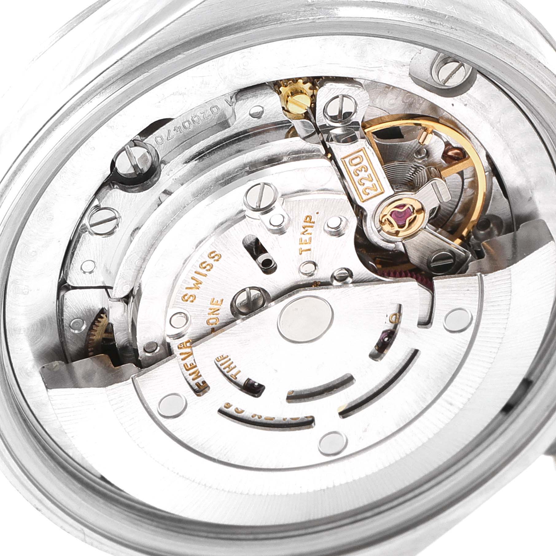 The image shows a close-up of the internal mechanical movement of a Rolex Mid-Size 77080 Women's Stainless Steel Pink Dial 77080 Women's Stainless Steel Pink Dial model watch.