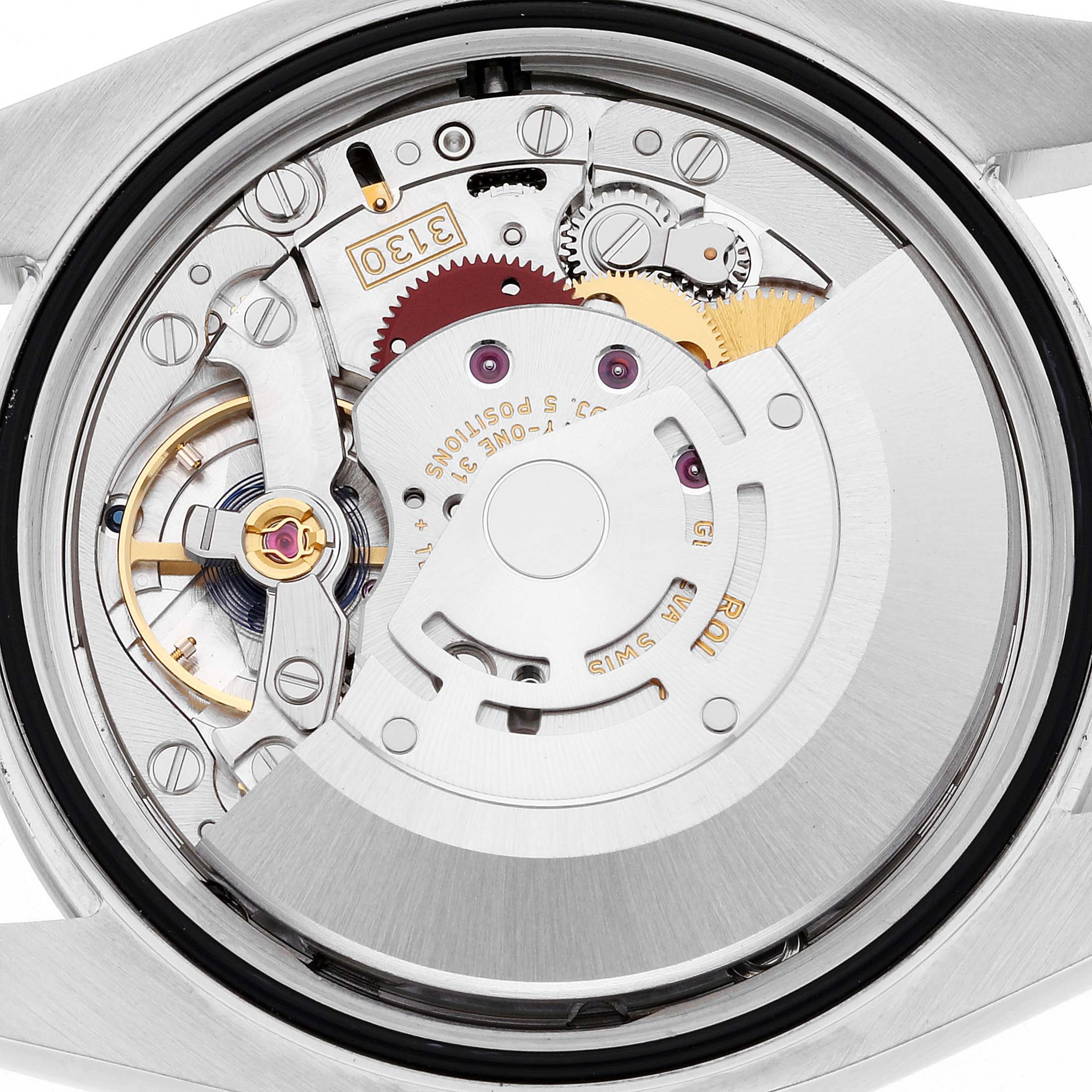 This image shows the inner mechanical movement of a Rolex Oyster Perpetual 116000 Men
s Stainless Steel Silver Dial 116000 Men
s Stainless Steel Silver Dial watch from a straight-on angle.
