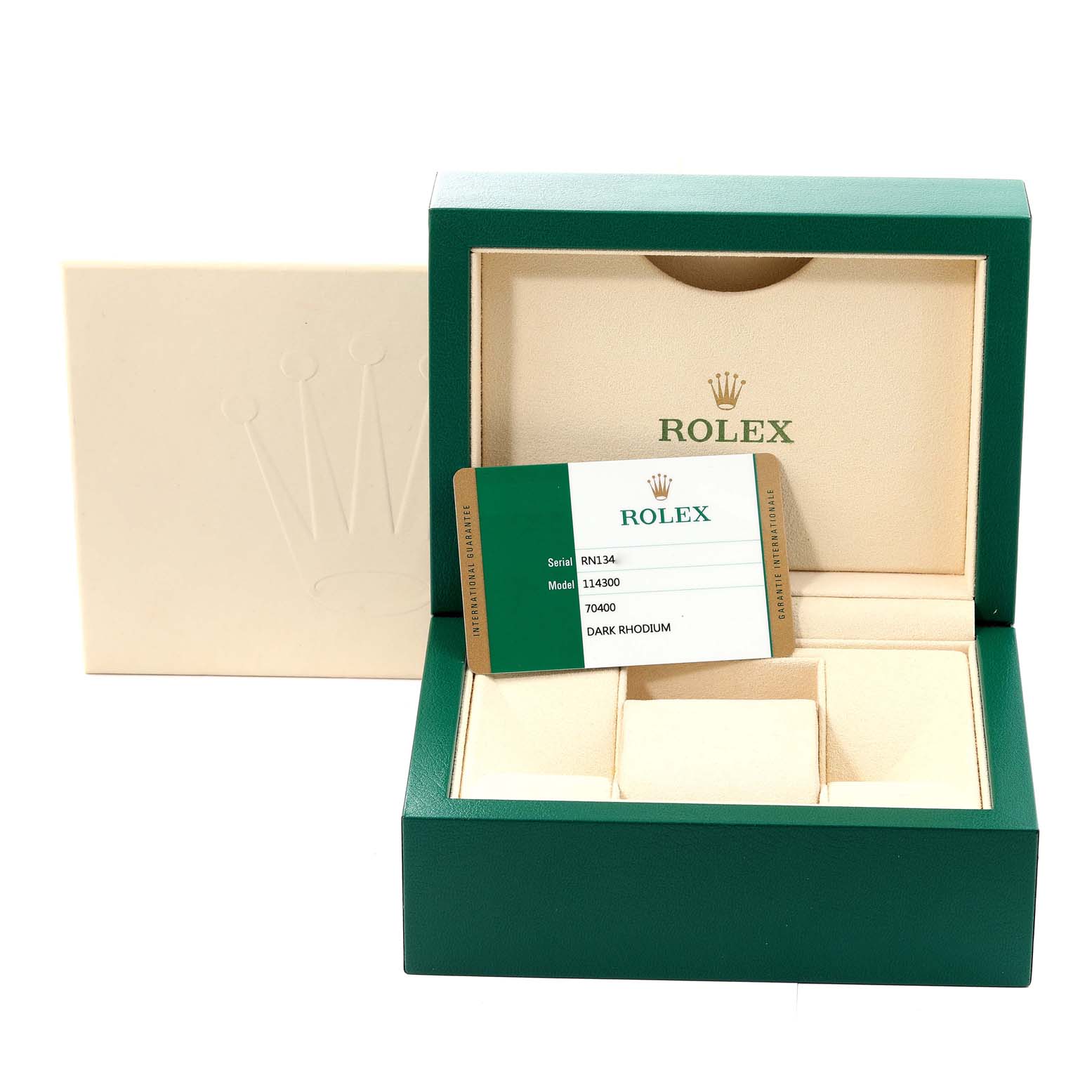 This image shows the packaging and certificate card for a Rolex Oyster Perpetual 114300 Men
s Stainless Steel Grey Dial 114300 Men
s Stainless Steel Grey Dial model 114300 in dark rhodium color.