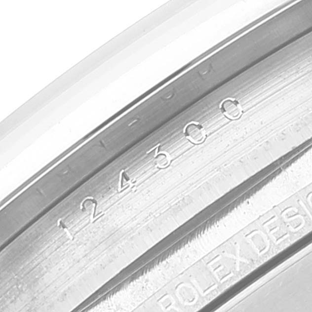 This close-up image shows the inner bezel of a Rolex Oyster Perpetual 124300 Men
s Stainless Steel Silver Dial 124300 Men
s Stainless Steel Silver Dial watch, displaying its model number 124300.