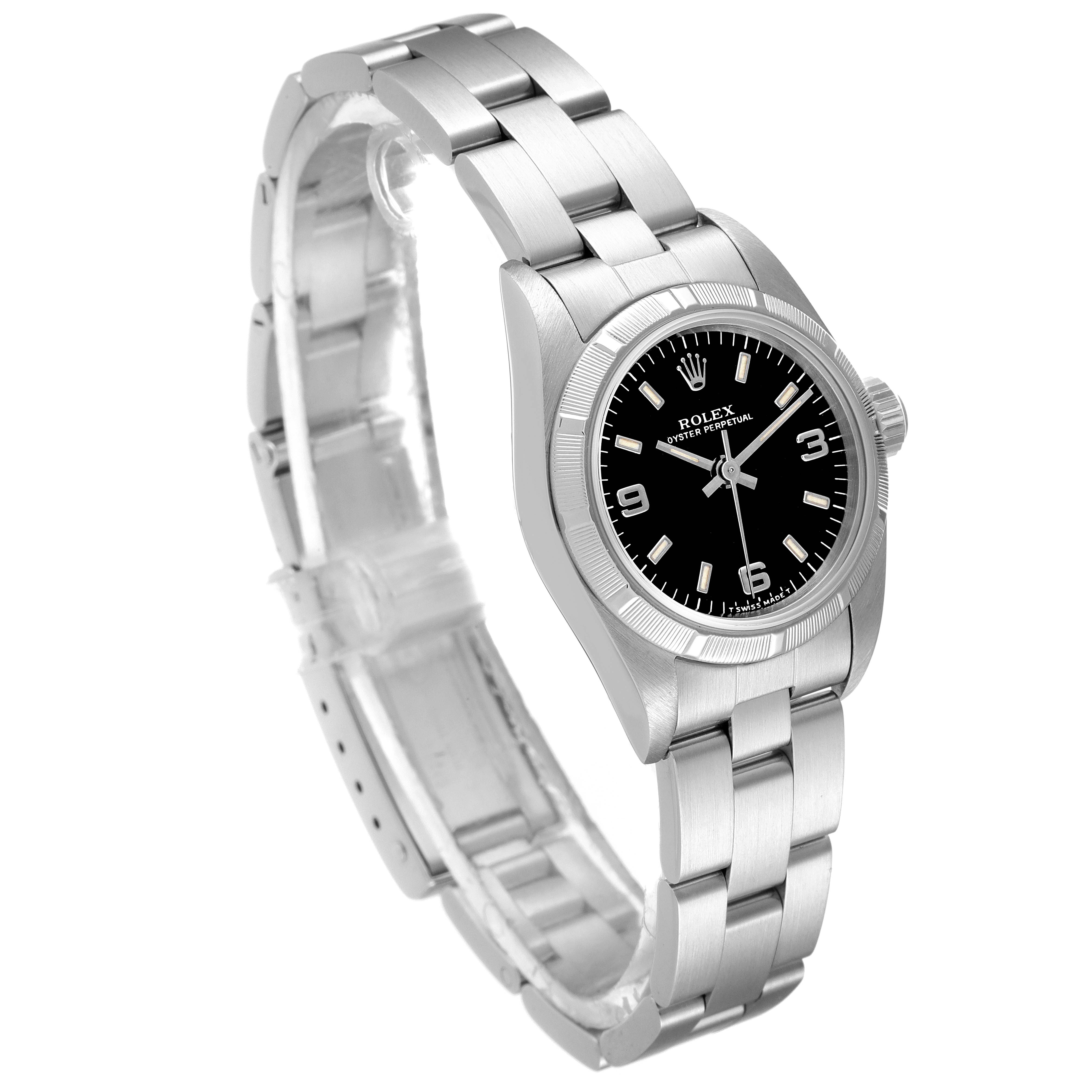 The image shows a Rolex Oyster Perpetual 67230 Women's Stainless Steel Black Dial 67230 Women's Stainless Steel Black Dial watch at a slight angle, highlighting its dial, bezel, and stainless steel bracelet.