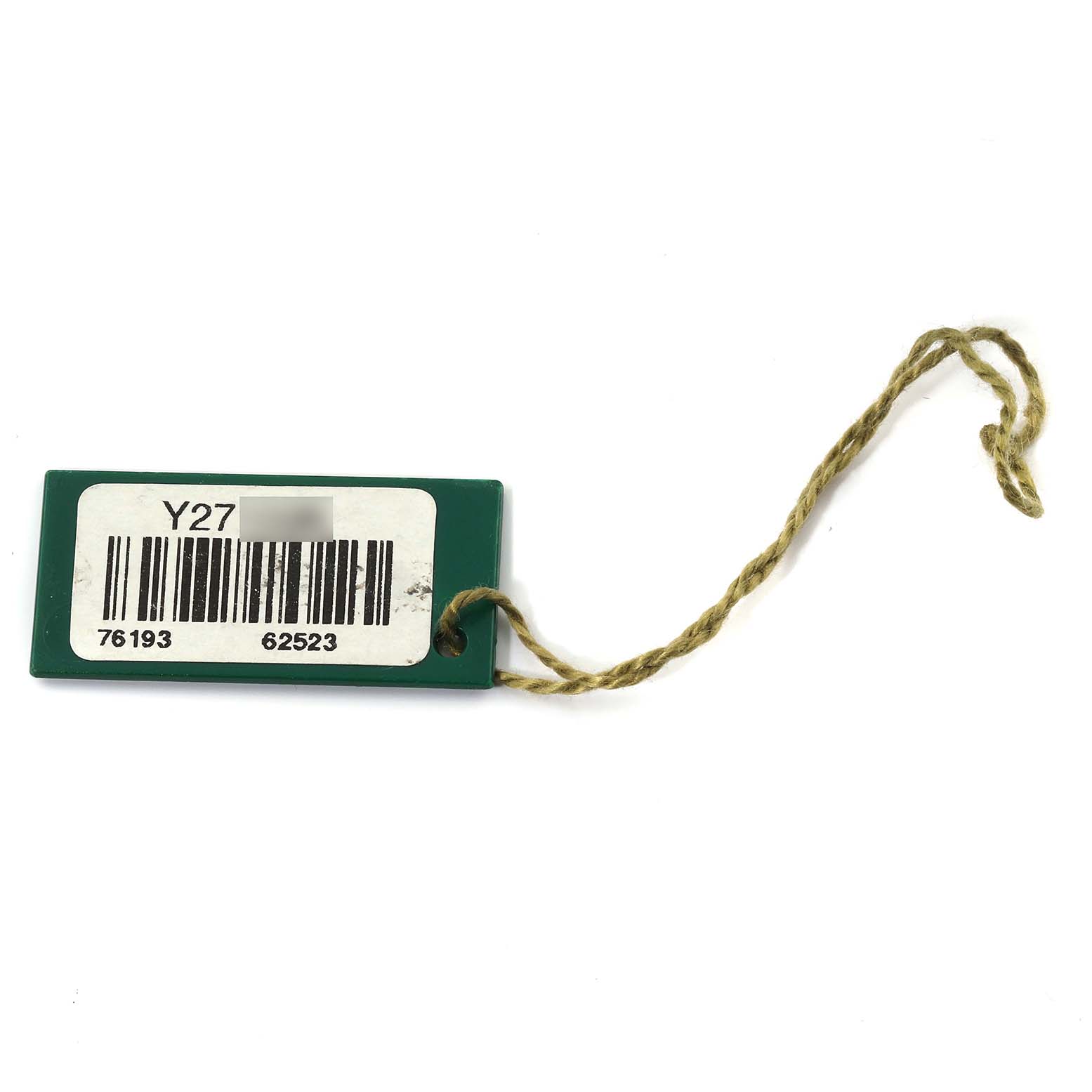 The image shows a green tag with a barcode and string, likely associated with a Rolex Oyster Perpetual 76193 Women's Steel and Gold (two tone) Black Dial 76193 Women's Steel and Gold (two tone) Black Dial watch.
