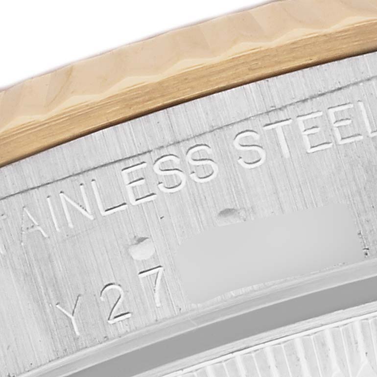 This image shows a close-up of the back side of the Oyster Perpetual watch by Rolex, specifically focusing on its stainless steel case.