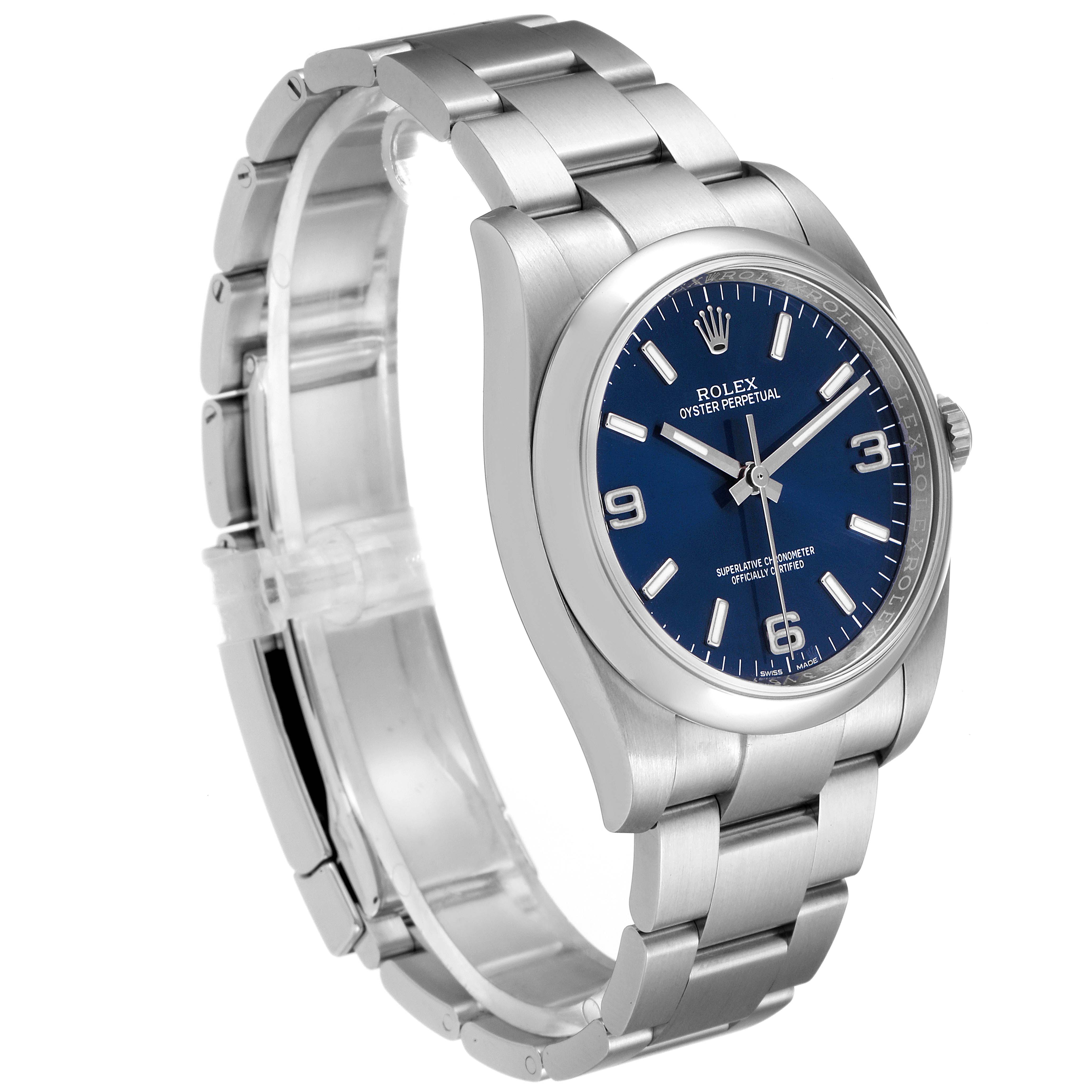 The image shows a side angle of the Rolex Oyster Perpetual 116000 Men's Stainless Steel Blue Dial 116000 Men's Stainless Steel Blue Dial watch, highlighting the bracelet, case, and blue dial.