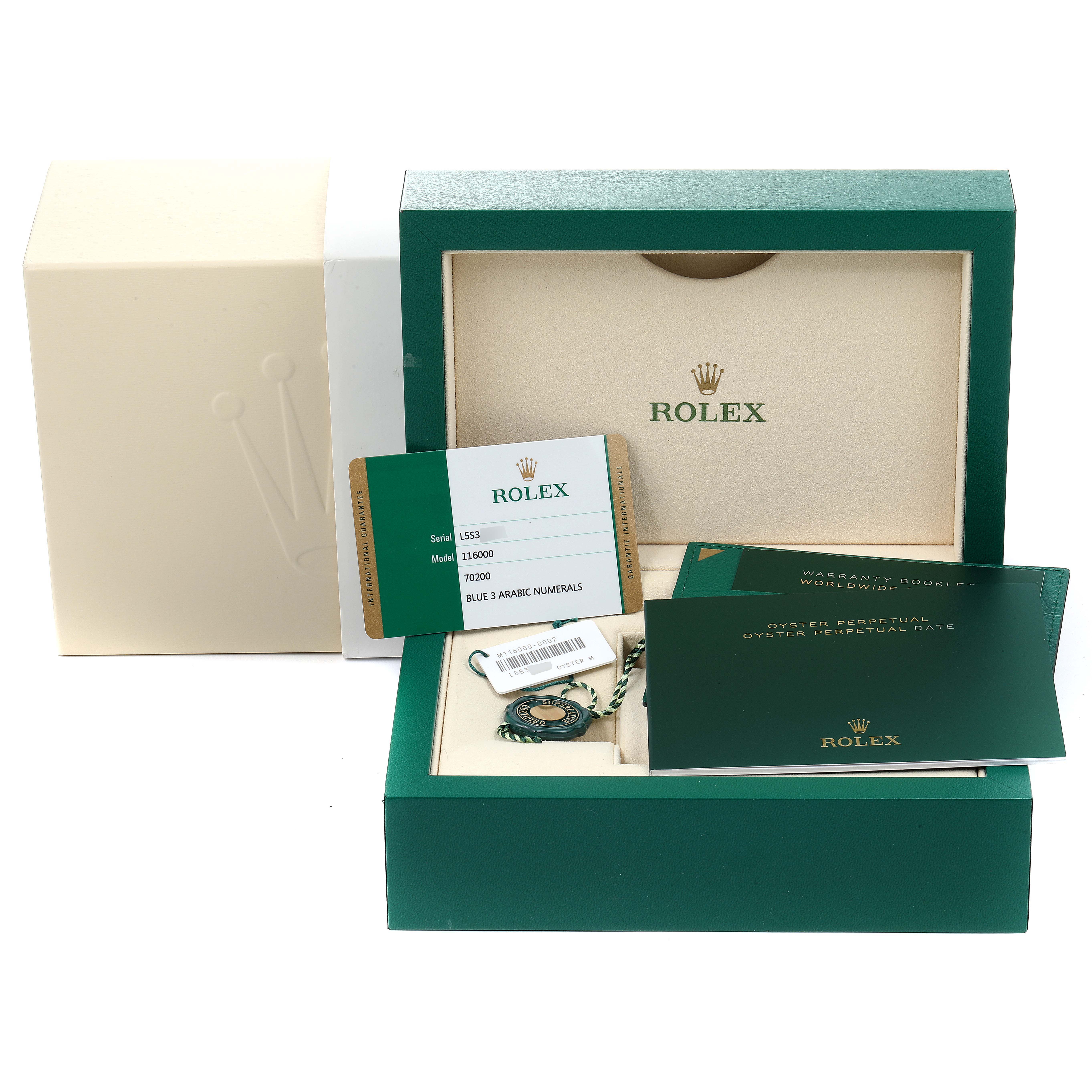 The image shows an open Rolex box containing documentation and tags for the Oyster Perpetual model, including warranty cards and manuals.