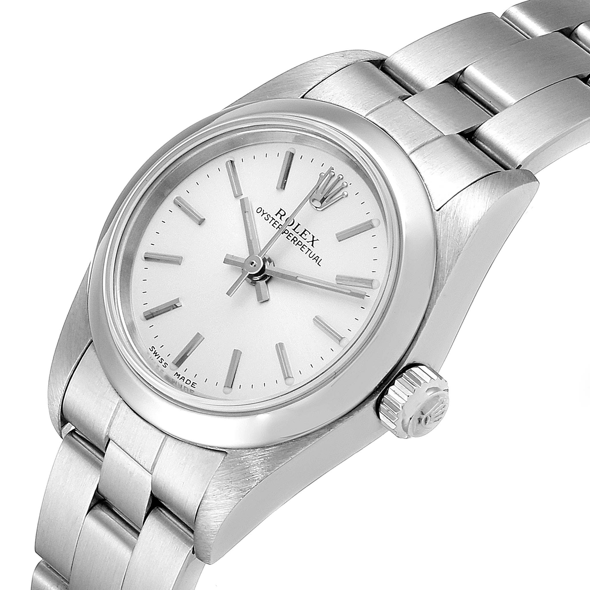 The Rolex Oyster Perpetual 76080 Women's Stainless Steel Silver Dial 76080 Women's Stainless Steel Silver Dial watch is shown from a front side angle, displaying the face, bezel, crown, and part of the bracelet.
