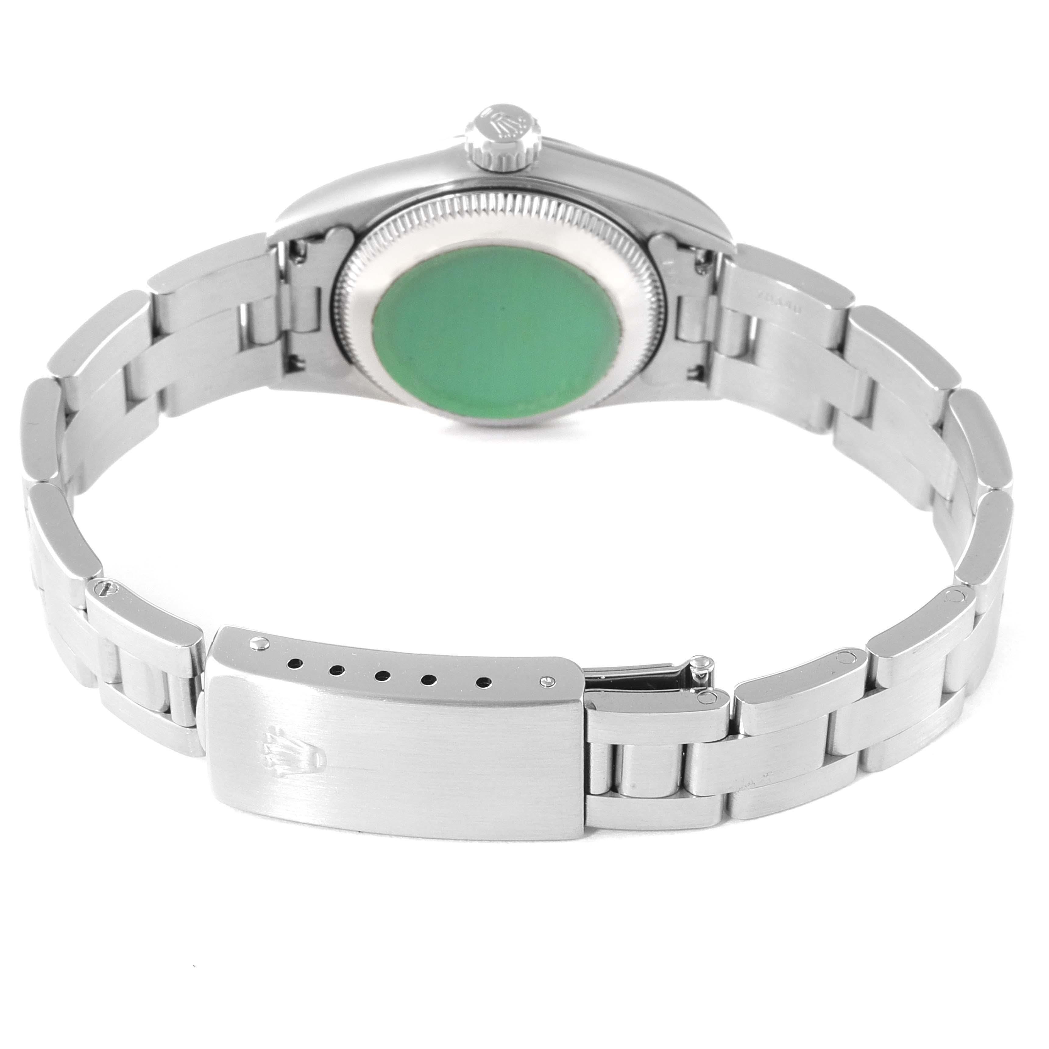 The image shows the backside of the Rolex Oyster Perpetual 67180 Women
s Stainless Steel Black Dial 67180 Women
s Stainless Steel Black Dial watch, highlighting the case back and the clasp of the bracelet.