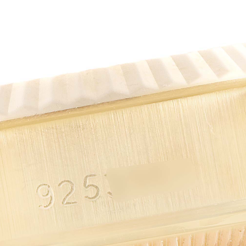 The image shows a close-up of the serial number engraved on the case of a Rolex President 69178 Women's Yellow Gold Blue Dial 69178 Women's Yellow Gold Blue Dial watch.