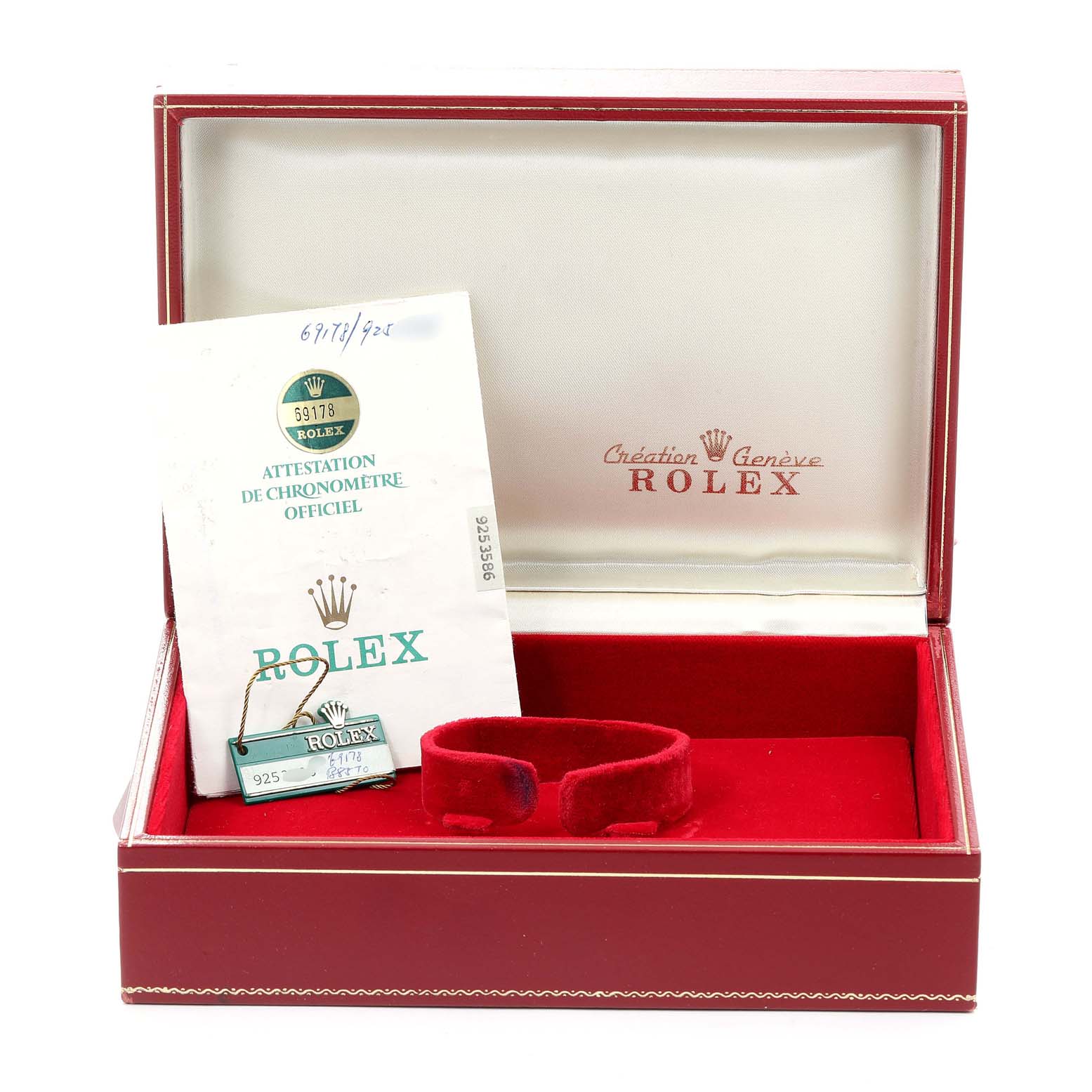 The image shows an open Rolex watch box for the President model, displaying its tag and official chronometer certification.