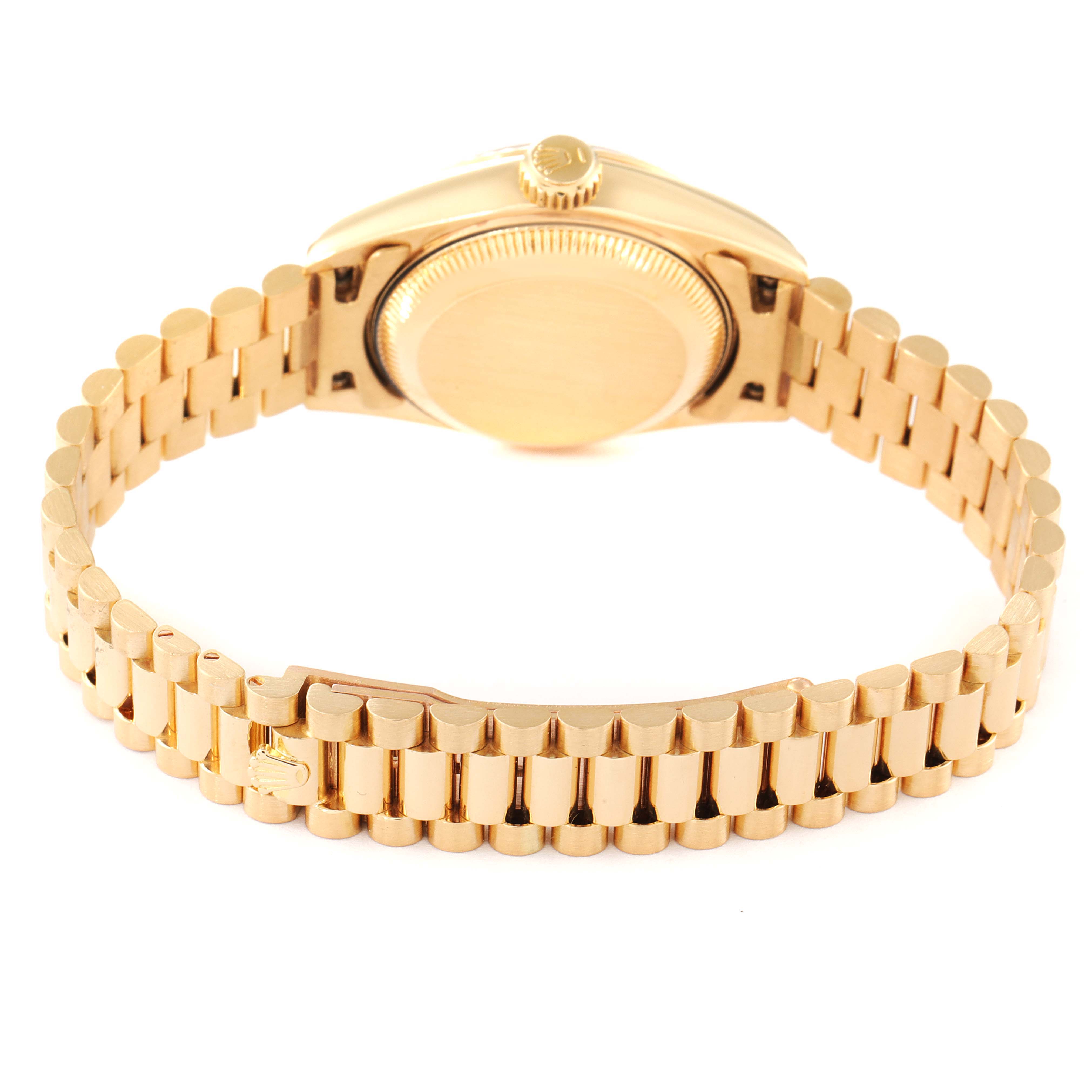 The image shows the back view of a Rolex President 69178 Women
s Yellow Gold Champagne Dial 69178 Women
s Yellow Gold Champagne Dial model watch, focusing on the case back, crown, and gold bracelet.