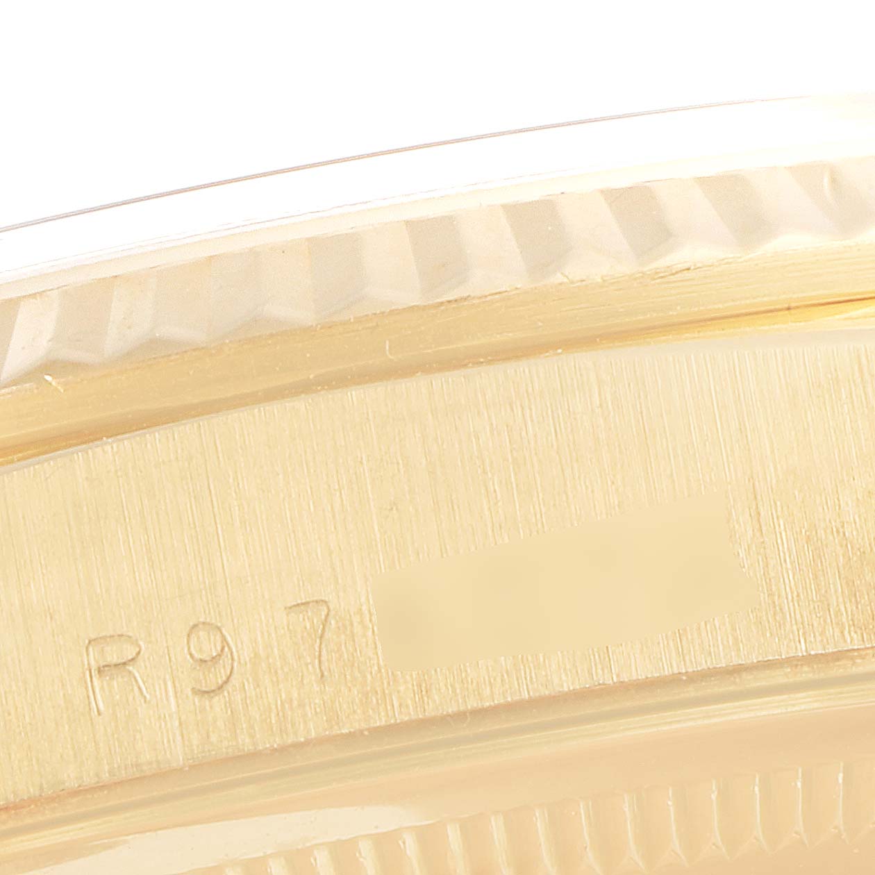 The image shows a close-up of the case and bezel of a Rolex President 18238 Men's Yellow Gold Silver Dial 18238 Men's Yellow Gold Silver Dial model watch, highlighting the serial number area.