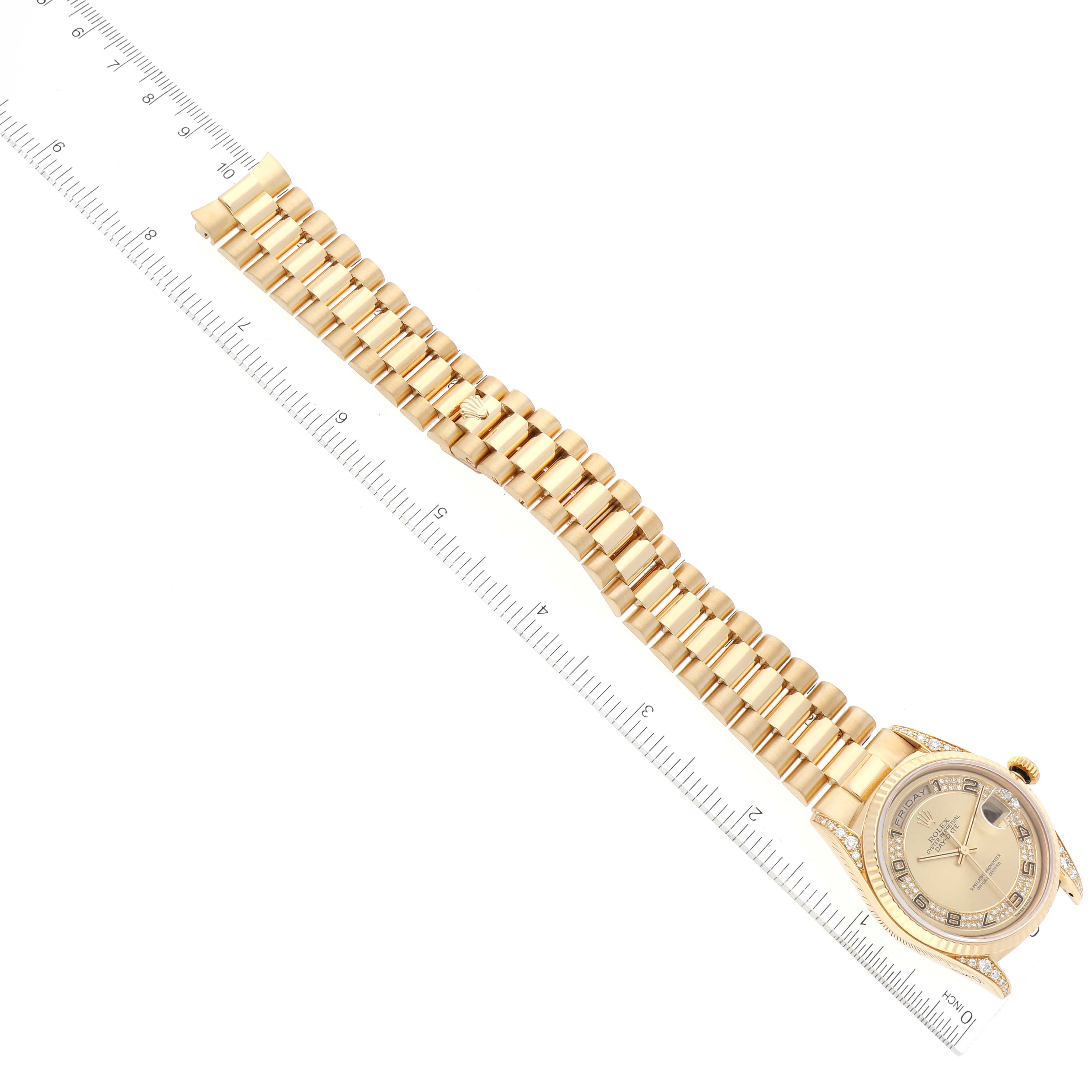 The image shows a top-down view of a Rolex President 18338 Men
s Yellow Gold Champagne Dial 18338 Men
s Yellow Gold Champagne Dial model watch, featuring its bracelet and face, next to a ruler for size reference.