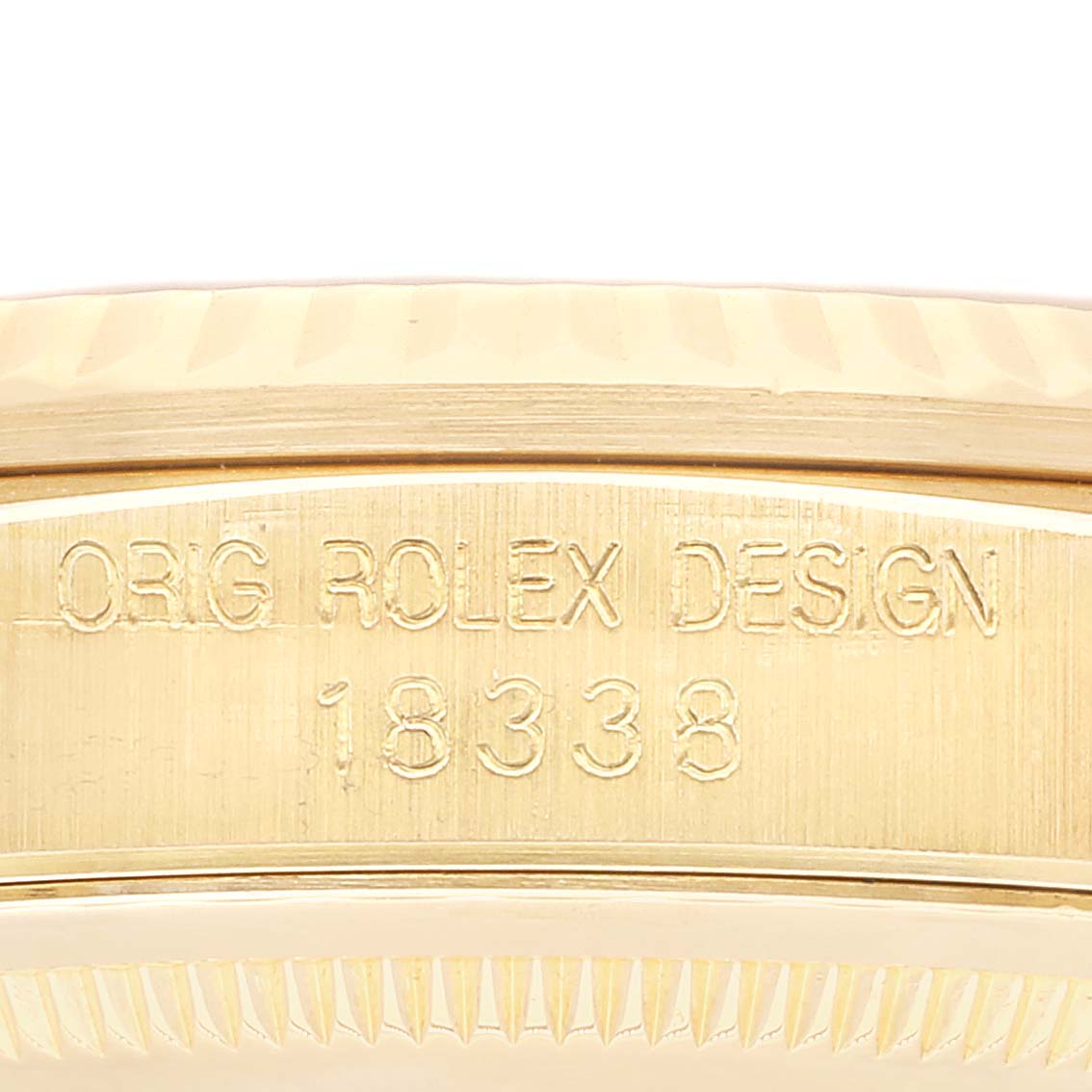 This close-up angle shows the model number and design engraving on the side of the Rolex President 18338 Men
s Yellow Gold Champagne Dial 18338 Men
s Yellow Gold Champagne Dial watch case.