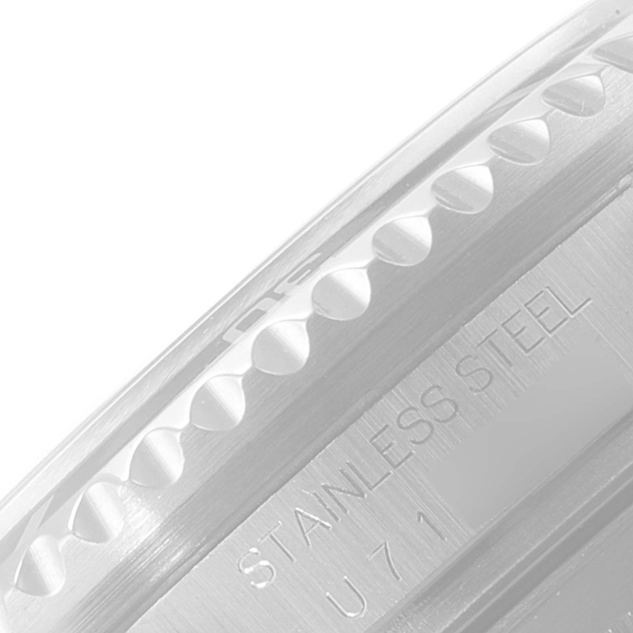 The image shows a close-up angle of the case side and bezel teeth of a Rolex Sea-Dweller 16600 Men
s Stainless Steel Black Dial 16600 Men
s Stainless Steel Black Dial watch, showcasing its "STAINLESS STEEL" engraving.