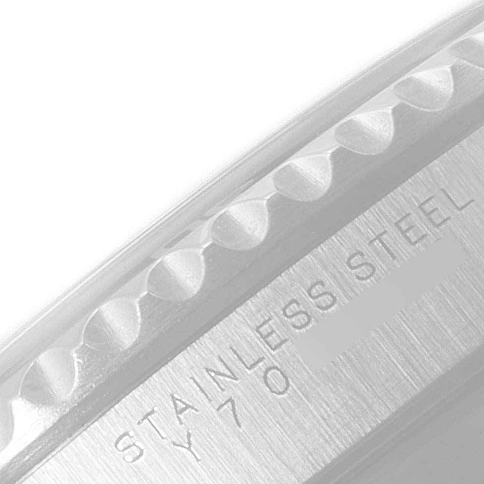 This image shows a close-up of the side of the bezel and case with engraved text on the Rolex Submariner 14060 Men
s Stainless Steel Black Dial 14060 Men
s Stainless Steel Black Dial.