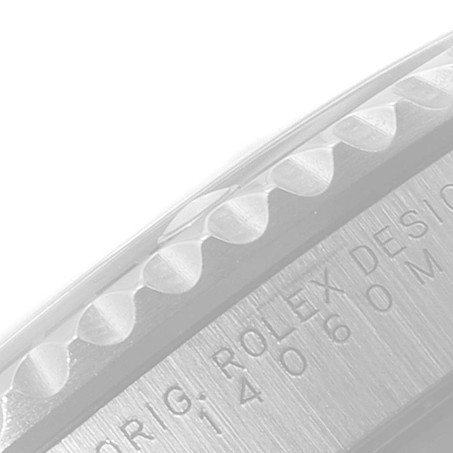 The image shows a close-up of the side engraving and bezel of a Rolex Submariner 14060 Men
s Stainless Steel Black Dial 14060 Men
s Stainless Steel Black Dial watch.