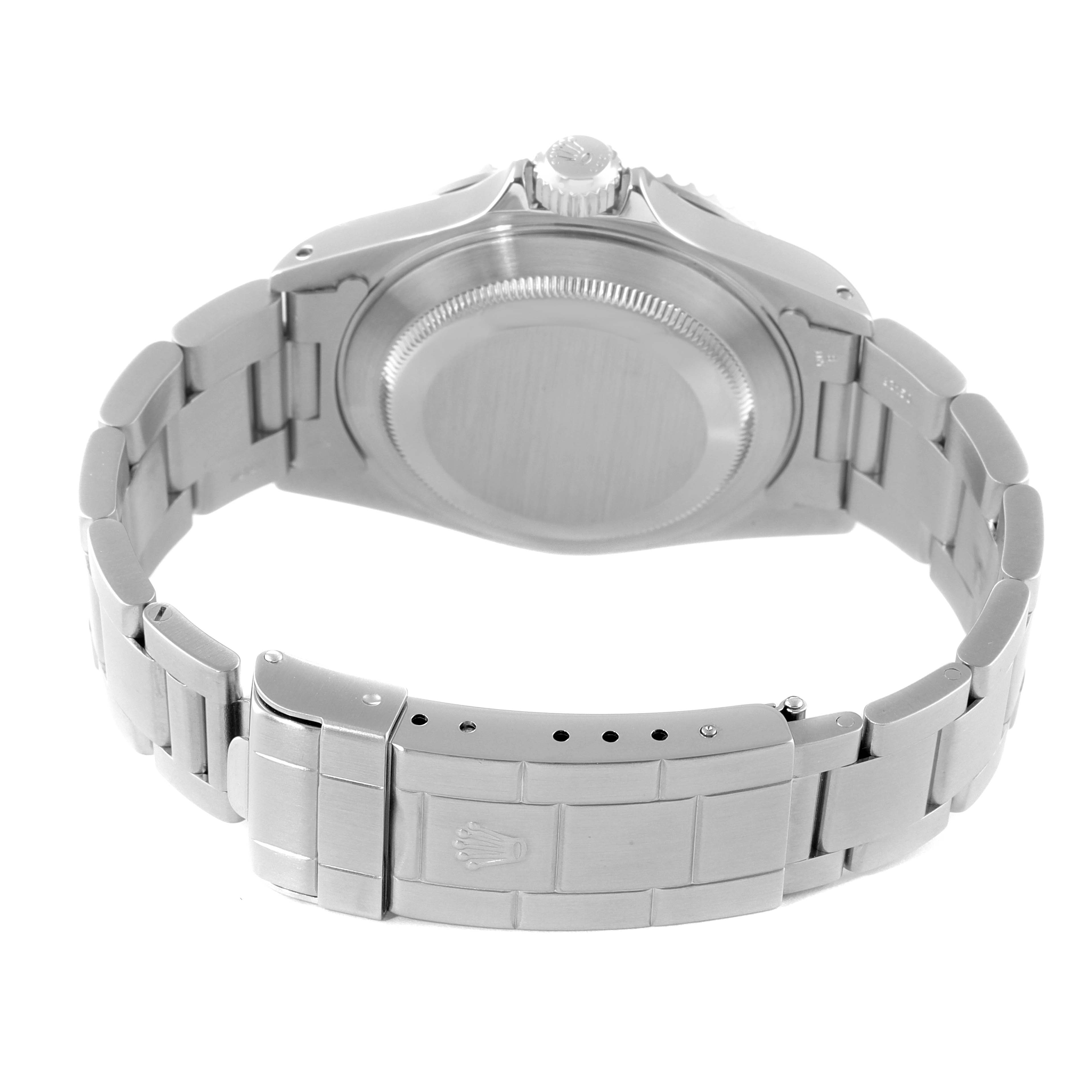 This image shows the back case, crown, and bracelet of a Rolex Submariner 14060 Men
s Stainless Steel Black Dial 14060 Men
s Stainless Steel Black Dial watch from a rear angle.