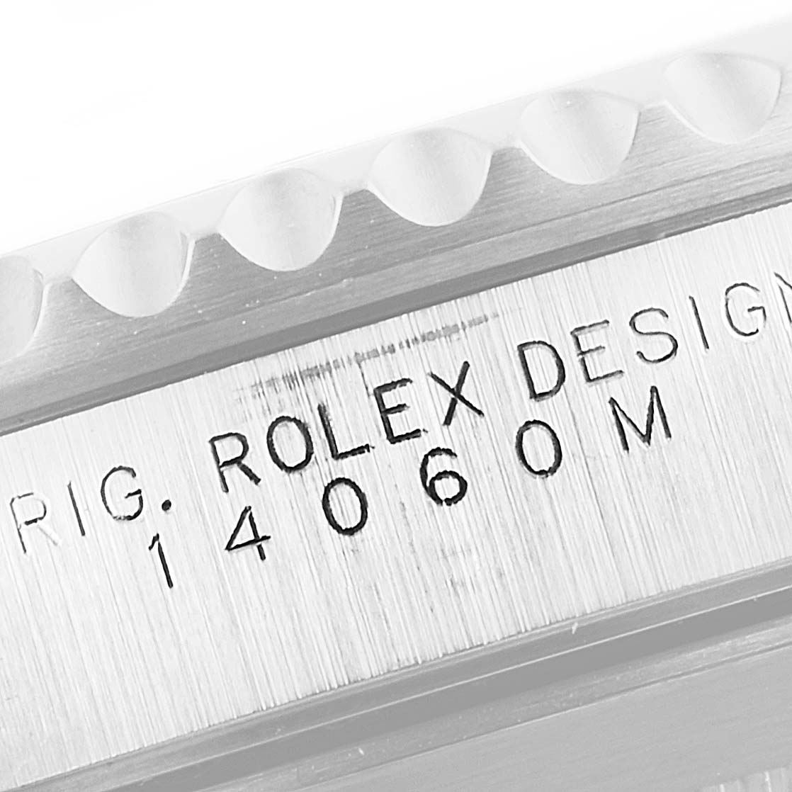 This image shows a close-up of the side of a Rolex Submariner 14060 Men's Stainless Steel Black Dial 14060 Men's Stainless Steel Black Dial watch, displaying the model number and branding.