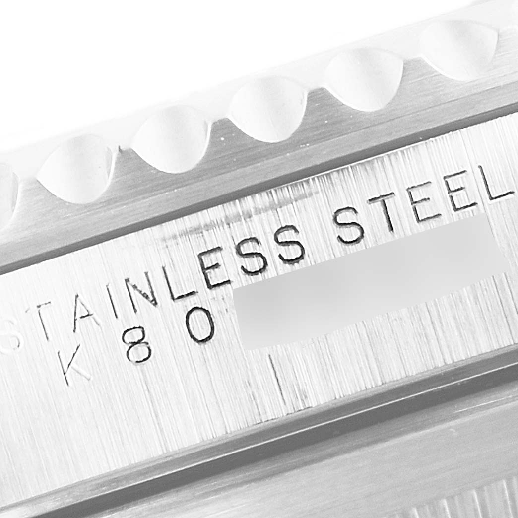 This image shows a close-up of the side engraving on a Rolex Submariner 14060 Men's Stainless Steel Black Dial 14060 Men's Stainless Steel Black Dial, highlighting the stainless steel mark.