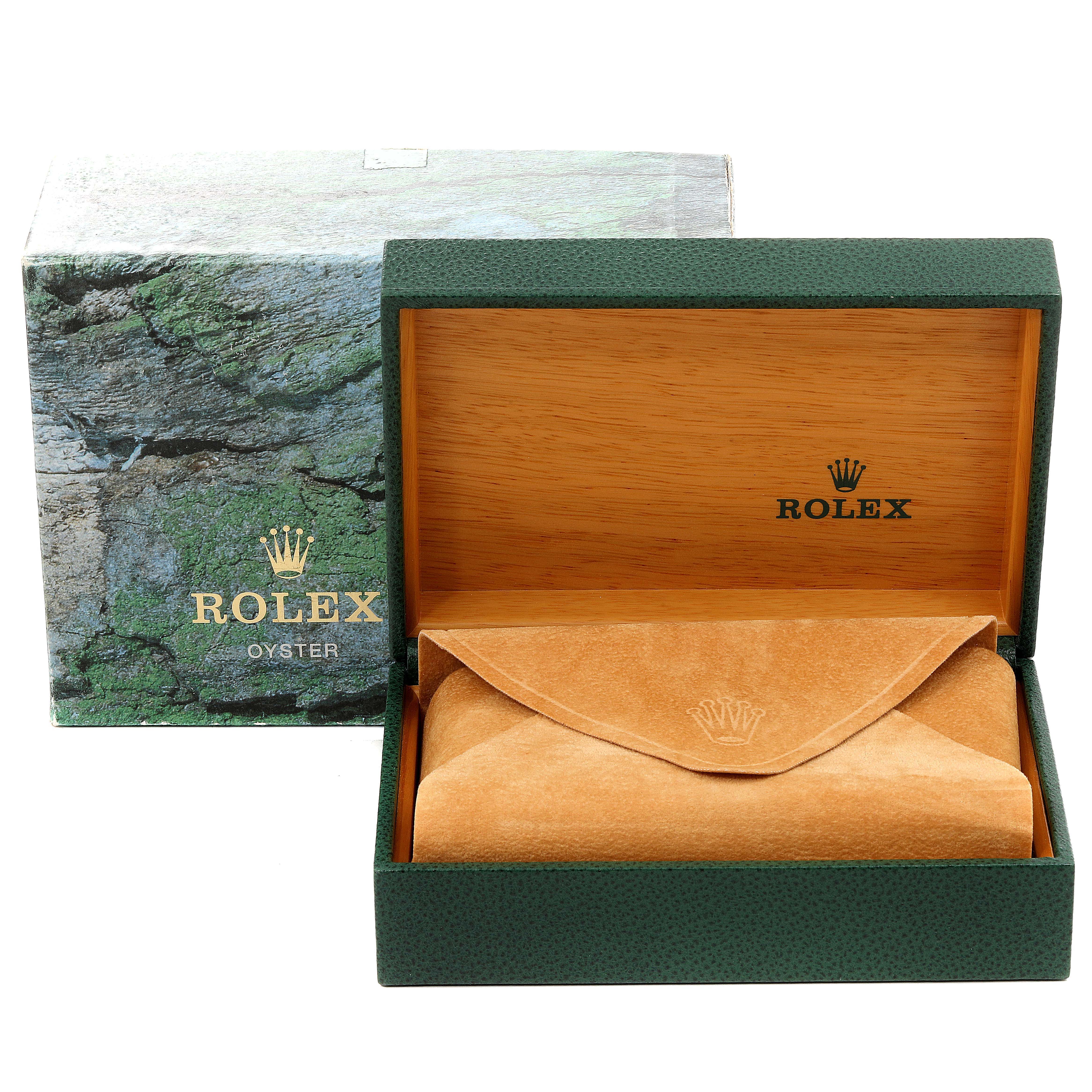 The image shows the packaging for a Rolex Submariner 14060 Men's Stainless Steel Black Dial 14060 Men's Stainless Steel Black Dial watch, including a green box with a brown leather pouch.