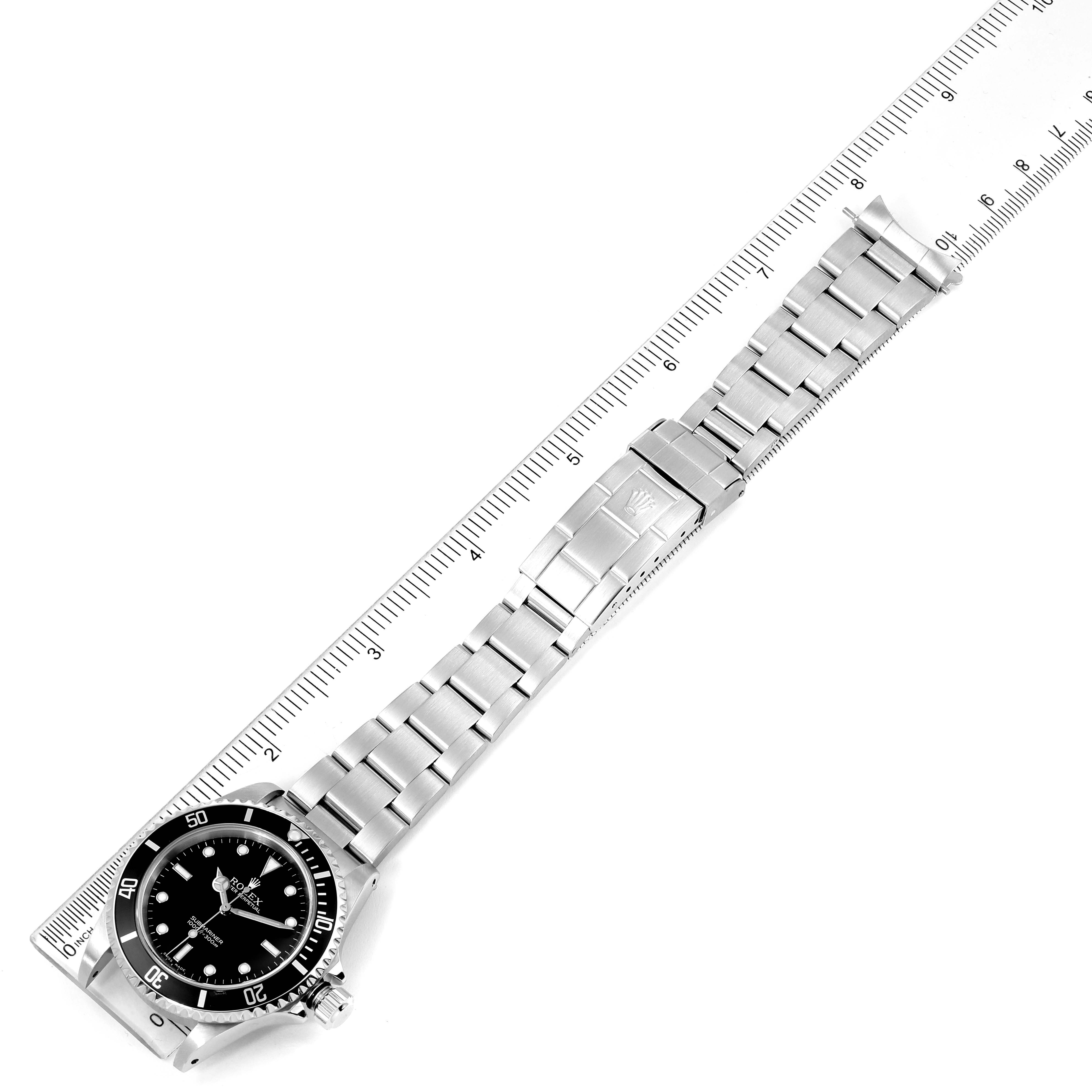 The image shows a Rolex Submariner 14060 Men's Stainless Steel Black Dial 14060 Men's Stainless Steel Black Dial watch lying flat with its bracelet fully extended and measured by a ruler.