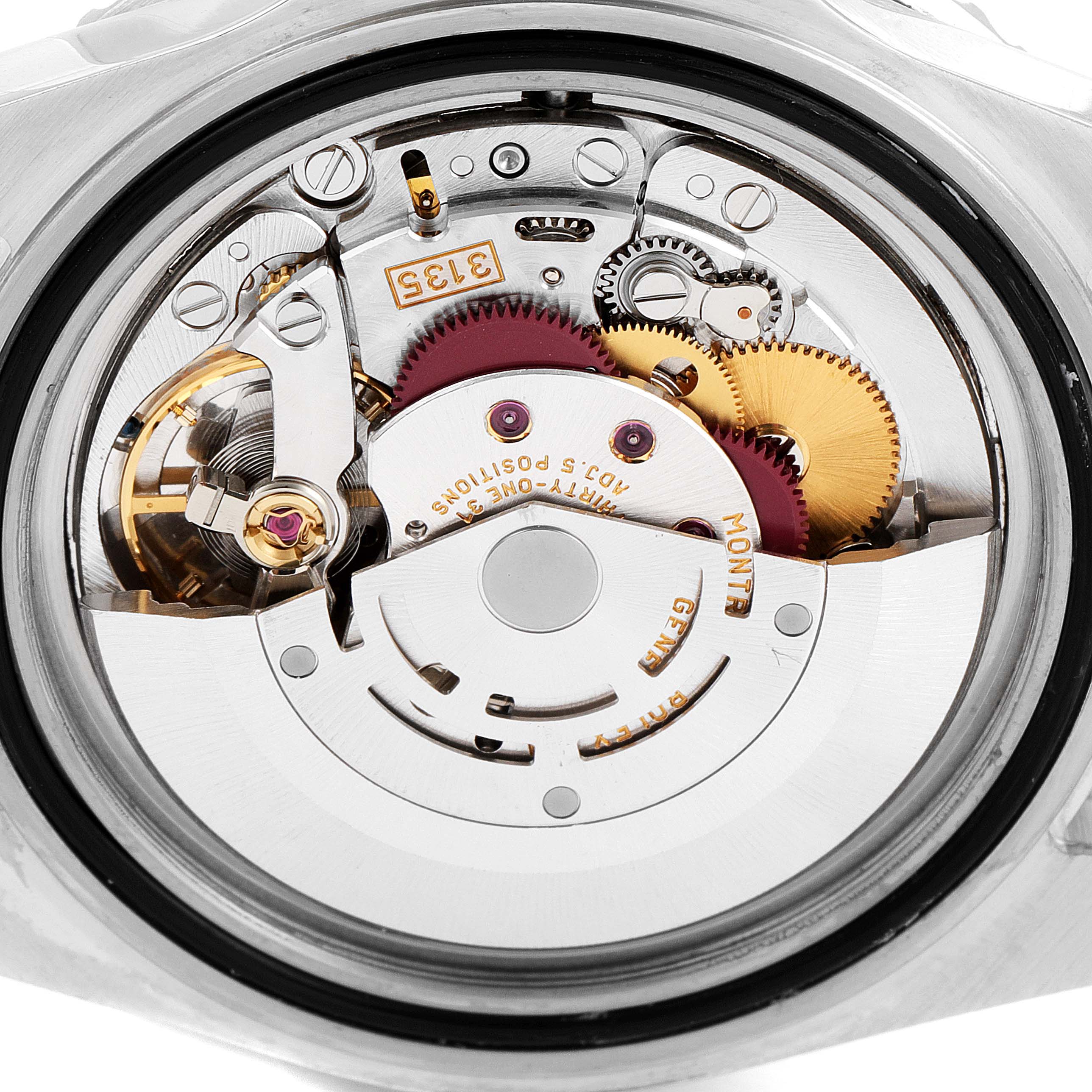 This is a close-up view of the movement and internal components of a Rolex Submariner 16610LV Men's Stainless Steel Black Dial 16610LV Men's Stainless Steel Black Dial watch.