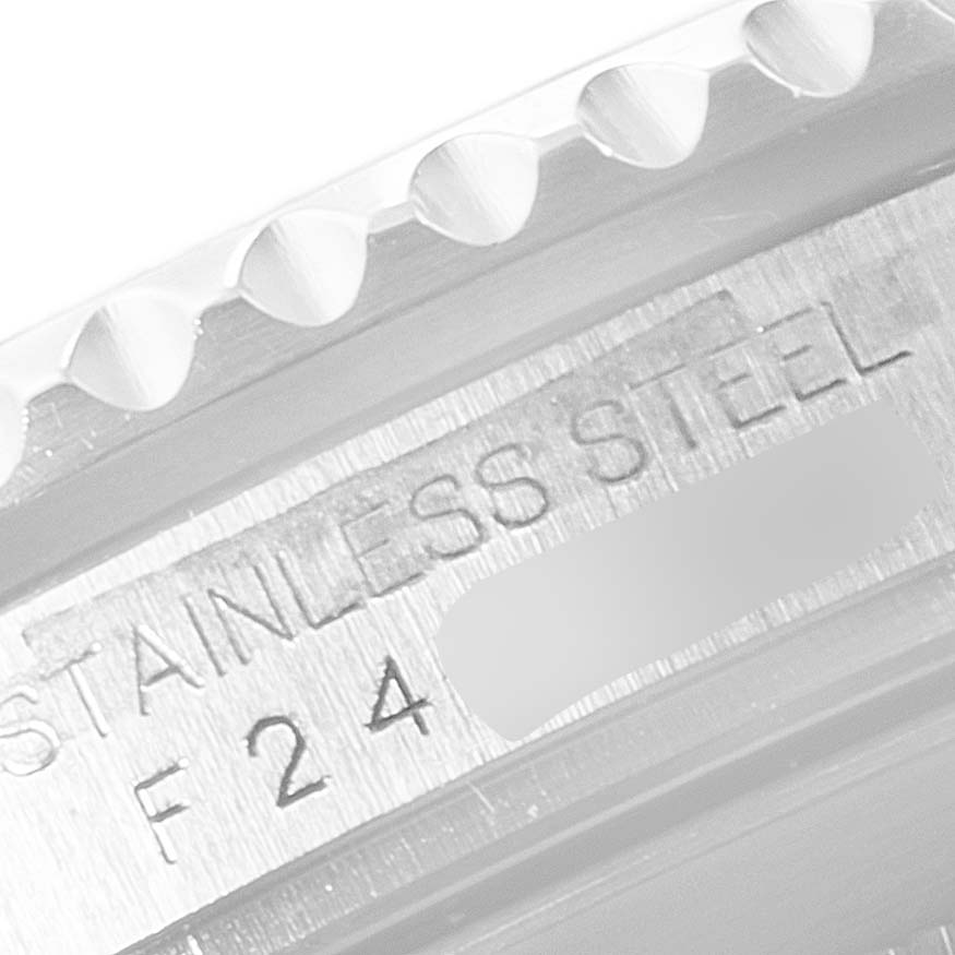 This image shows a close-up angle of the bezel and casing with the "STAINLESS STEEL" marking on a Rolex Submariner 16610LV Men's Stainless Steel Black Dial 16610LV Men's Stainless Steel Black Dial watch.