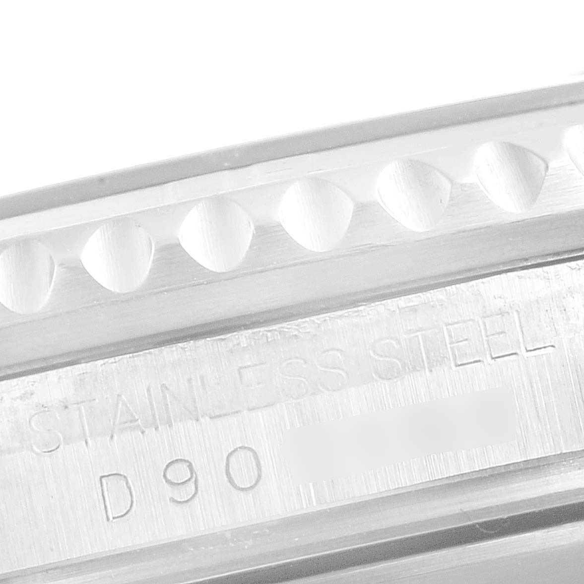 This close-up image shows the side of a Rolex Submariner 16610LV Men
s Stainless Steel Black Dial 16610LV Men
s Stainless Steel Black Dial watch, highlighting its stainless steel case and engraved text.