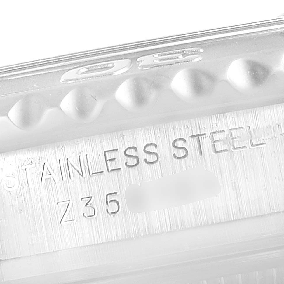 This image shows a close-up of the Rolex Yacht-Master 169622 Women's Stainless Steel Silver Dial 169622 Women's Stainless Steel Silver Dial case, highlighting the stainless steel material and part of the serial number.