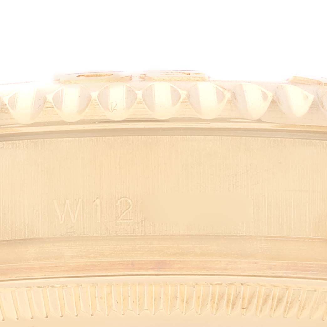 The image shows a close-up of the bezel and case of the Rolex Yacht-Master 68628 Men's Yellow Gold White Dial 68628 Men's Yellow Gold White Dial watch.