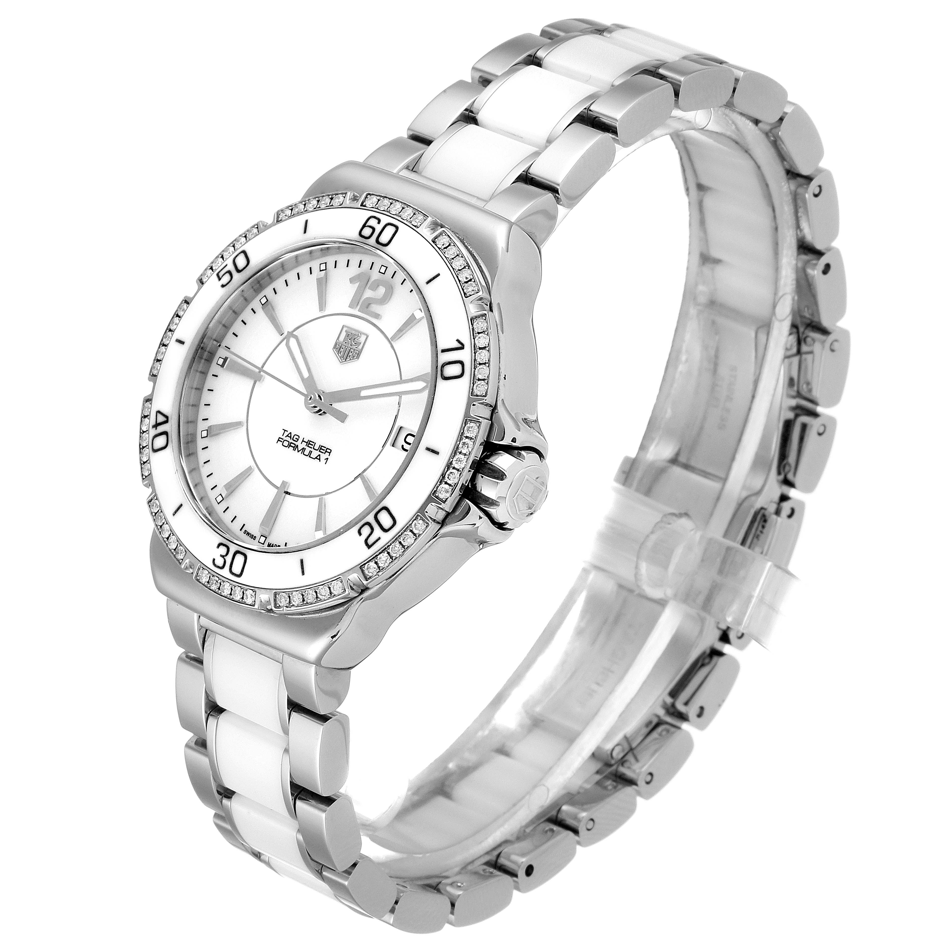 The image shows a Tag Heuer Formula 1 WAH1213.BA0861 Women's Stainless Steel White Dial WAH1213.BA0861 Women's Stainless Steel White Dial watch from an angled view, highlighting the bezel, dial, and stainless steel bracelet.