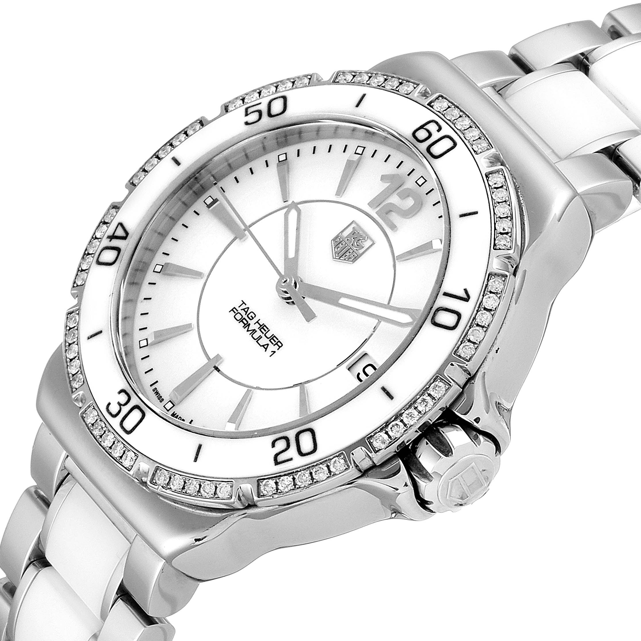 This image shows a side angle of the Tag Heuer Formula 1 WAH1213.BA0861 Women's Stainless Steel White Dial WAH1213.BA0861 Women's Stainless Steel White Dial watch, highlighting the face, bezel, crown, and part of the bracelet.