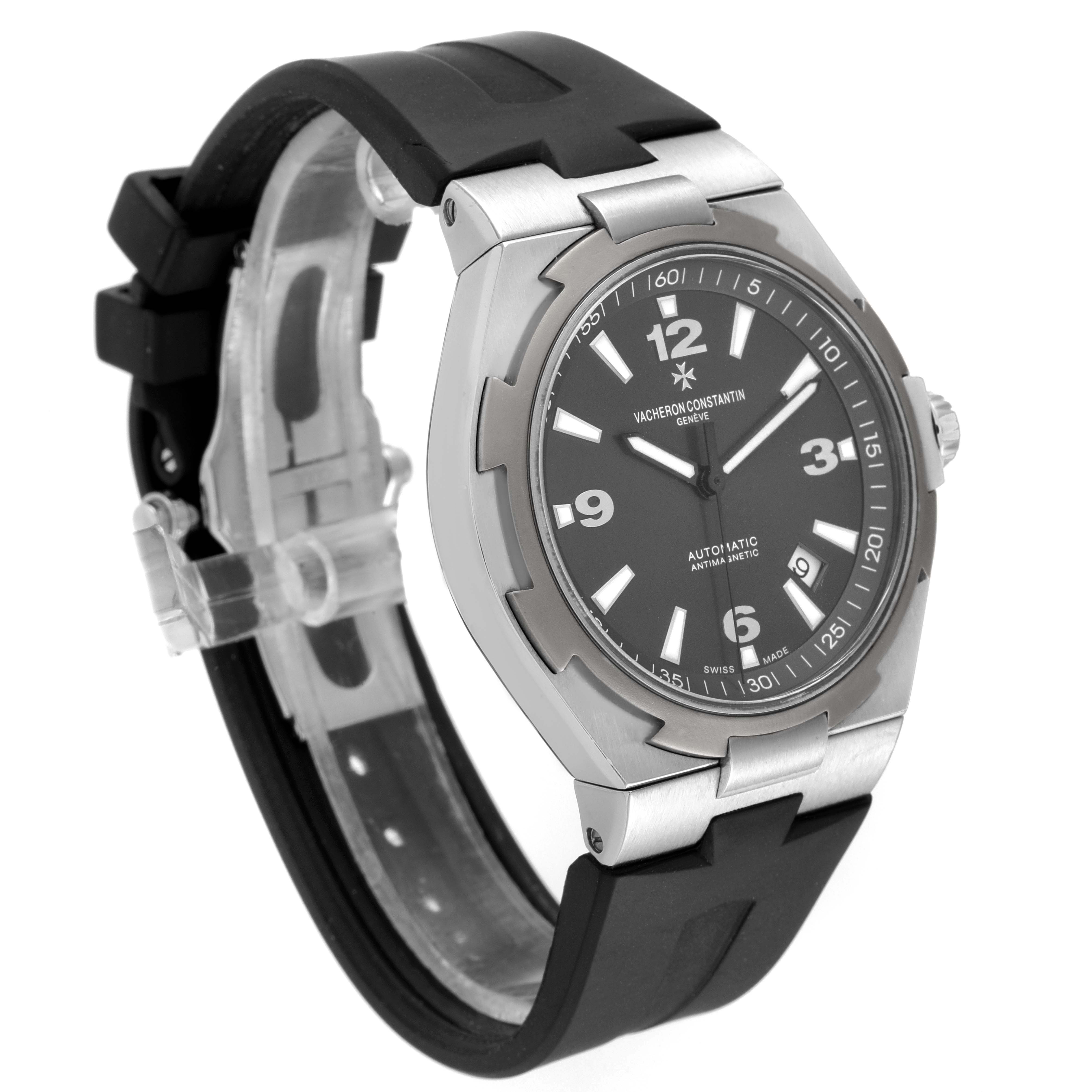 The Vacheron Constantin Overseas 47040/000W-9500 Men's Stainless Steel Black Dial 47040/000W-9500 Men's Stainless Steel Black Dial watch is shown in a three-quarter angle, displaying the face, bezel, case, and part of the strap.