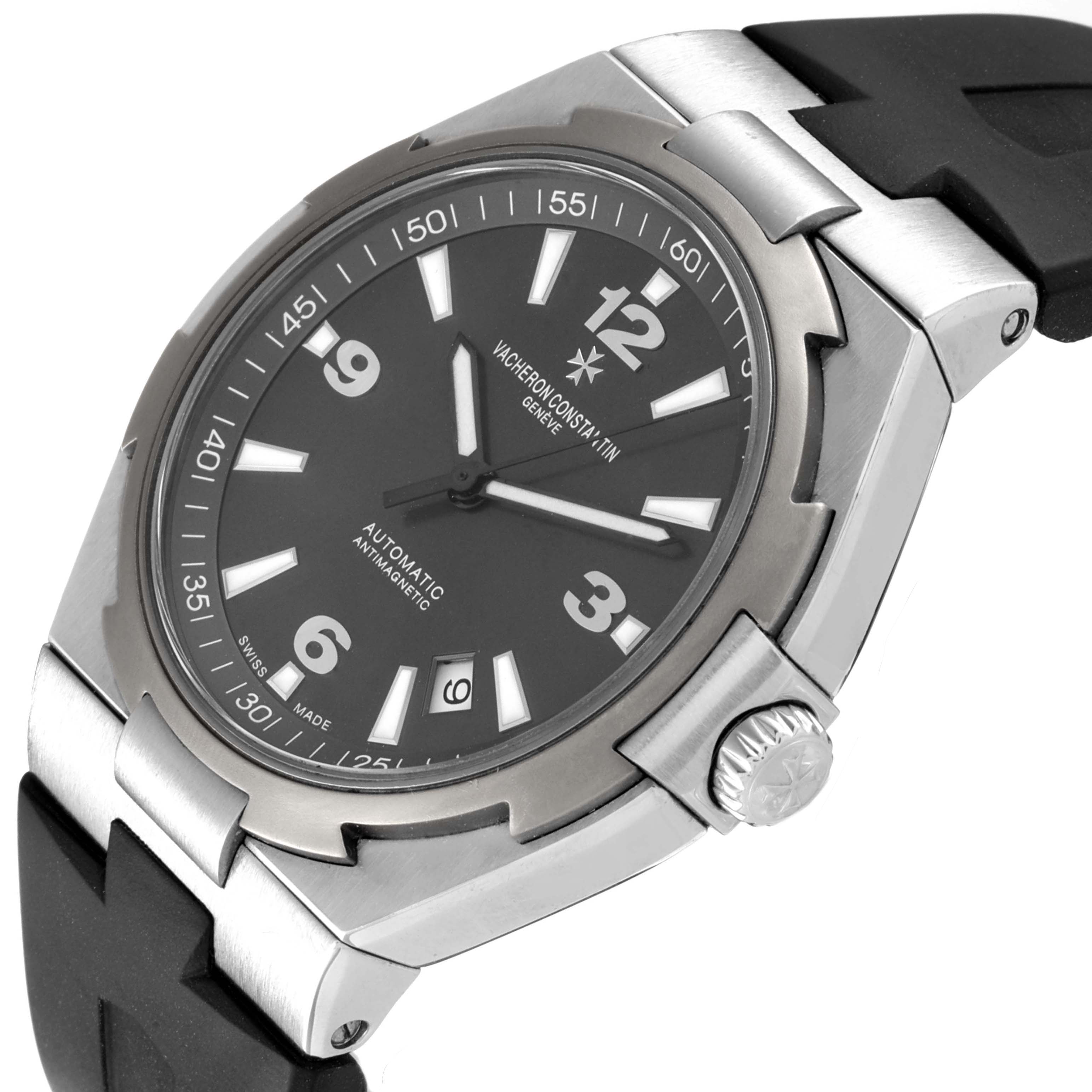 The image shows a Vacheron Constantin Overseas 47040/000W-9500 Men's Stainless Steel Black Dial 47040/000W-9500 Men's Stainless Steel Black Dial watch at a slight angle, displaying the face, crown, and part of the strap.