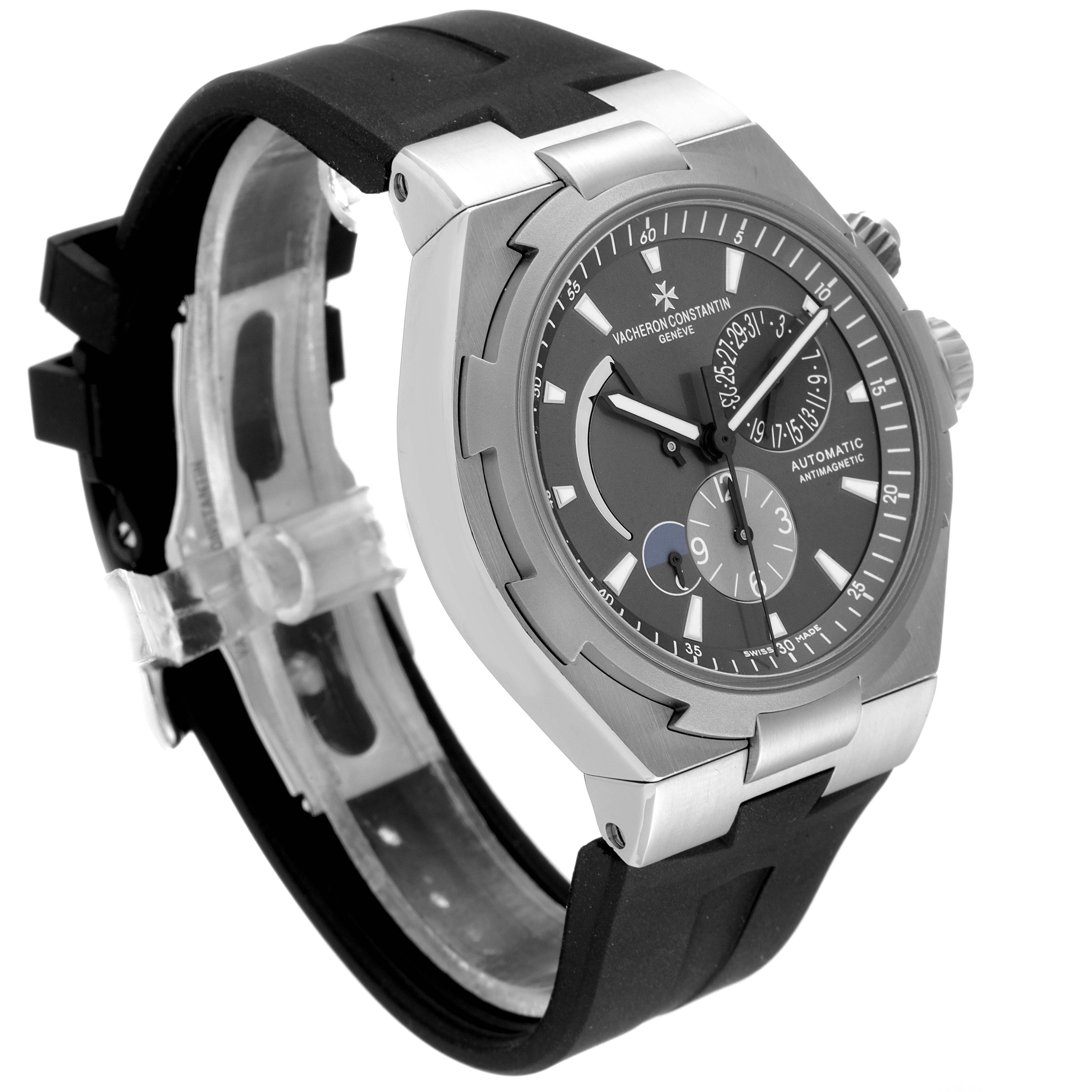 This image shows a Vacheron Constantin Overseas 47450/000W-9511 Men's Stainless Steel Grey Dial 47450/000W-9511 Men's Stainless Steel Grey Dial model watch from the side, highlighting the face, bezel, and upper portion of the strap.