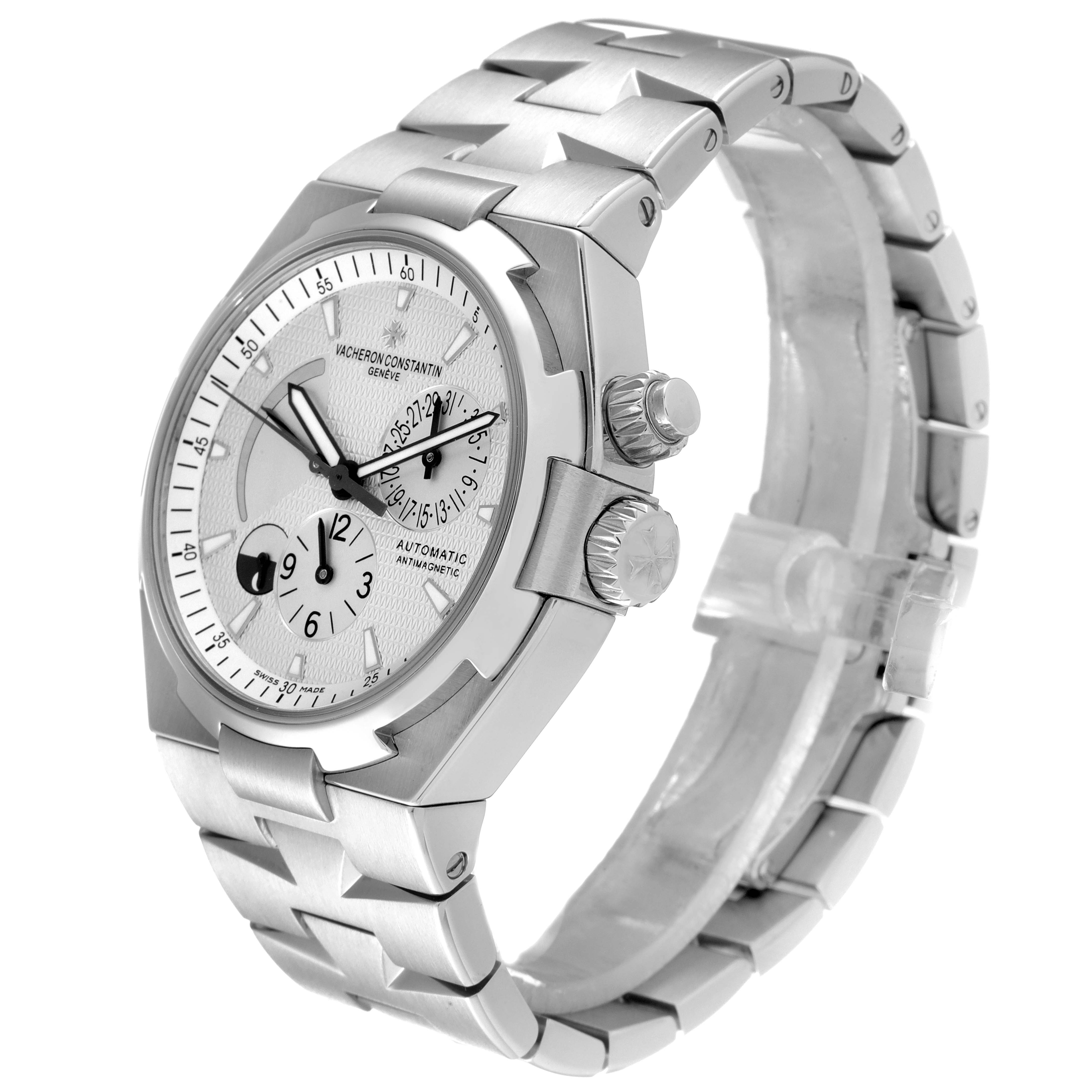 The Vacheron Constantin Overseas 47450/B01A-9226 Men's Stainless Steel Silver Dial 47450/B01A-9226 Men's Stainless Steel Silver Dial watch is shown at a slight angle highlighting the face, bezel, crown, and part of the bracelet.