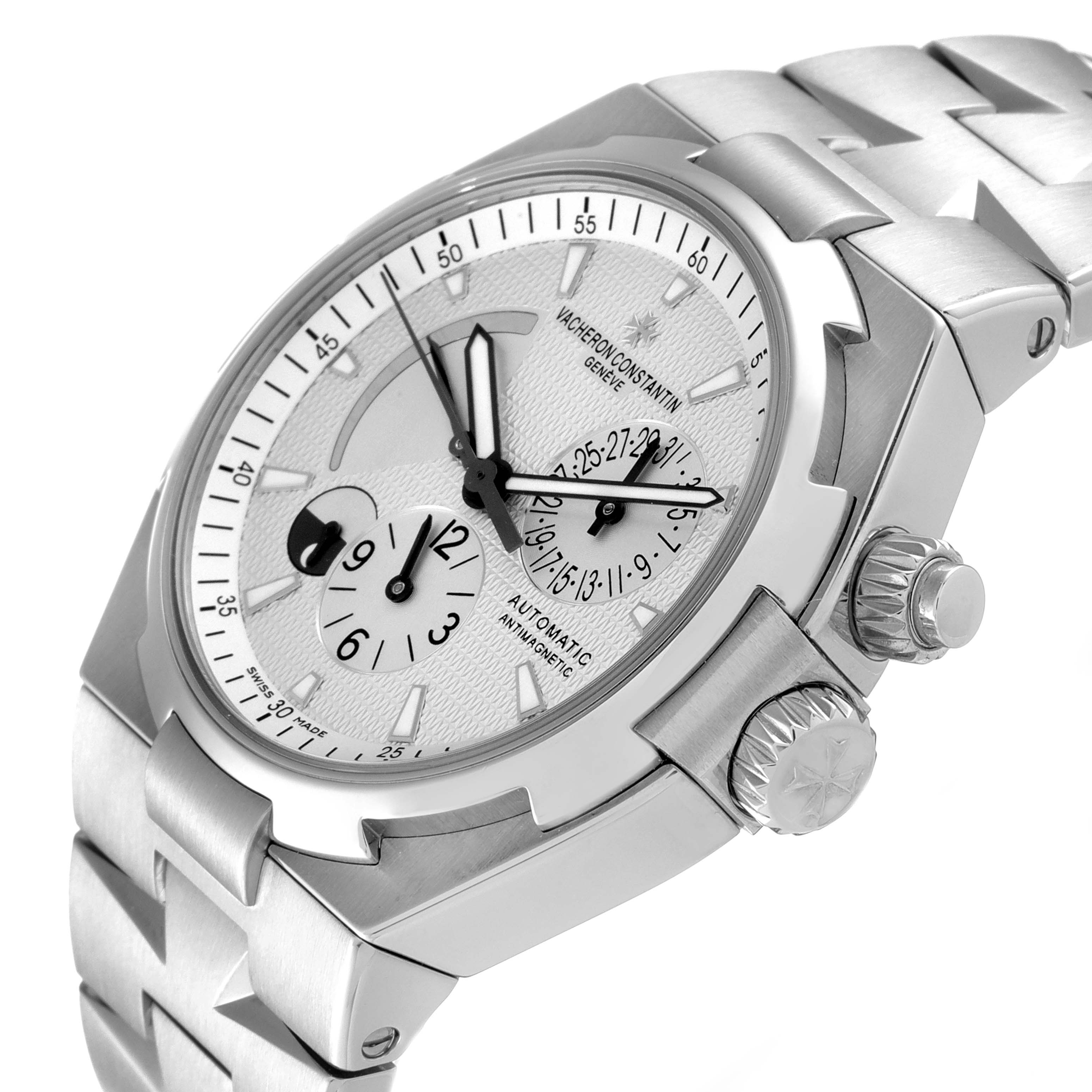 The Vacheron Constantin Overseas 47450/B01A-9226 Men's Stainless Steel Silver Dial 47450/B01A-9226 Men's Stainless Steel Silver Dial watch is shown at a slight angle highlighting the dial, bezel, crown, and part of the bracelet.
