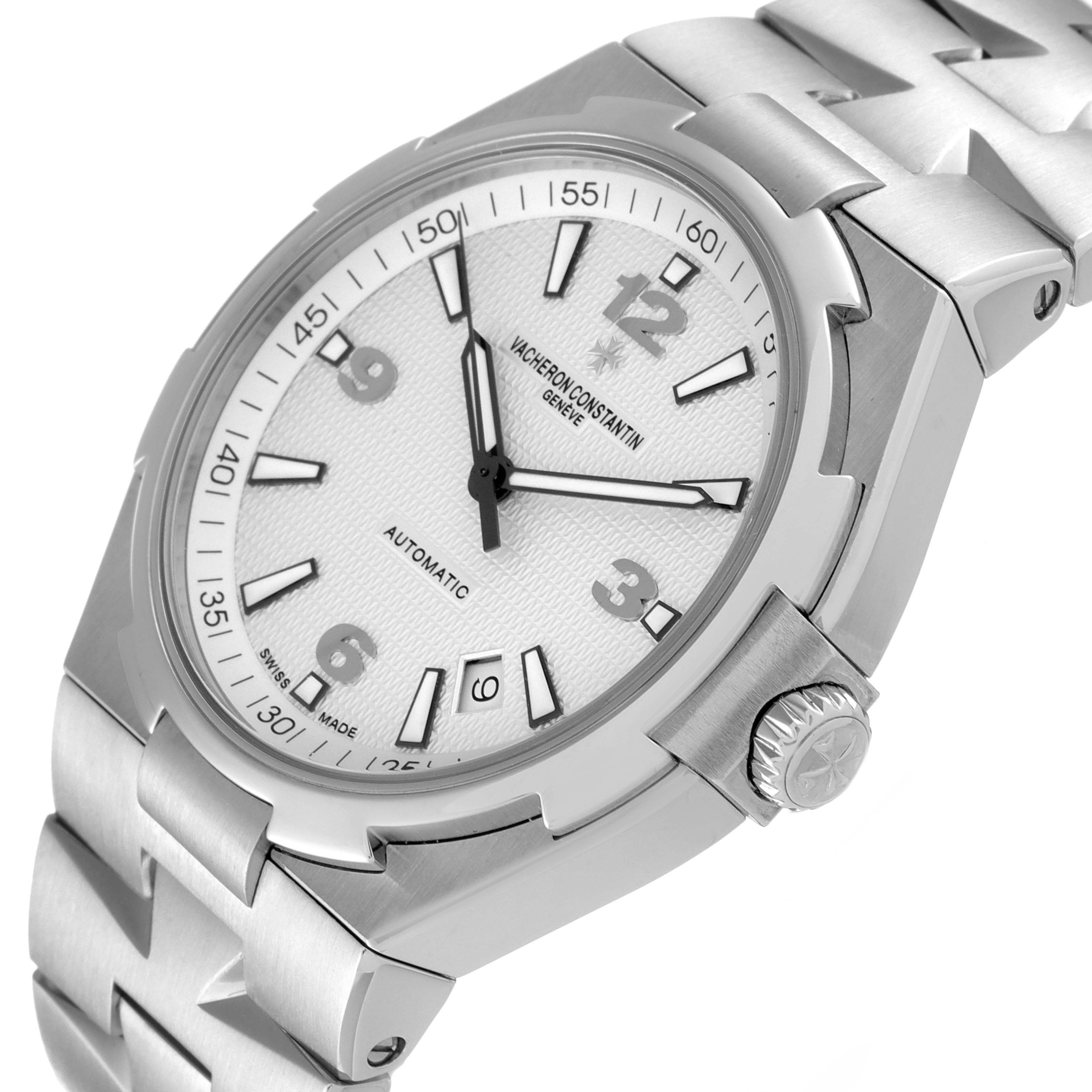 This image shows a Vacheron Constantin Overseas 47040B01A-9093 Men's Stainless Steel Silver Dial 47040B01A-9093 Men's Stainless Steel Silver Dial watch at a slight angle, showcasing its dial, crown, and part of the bracelet.