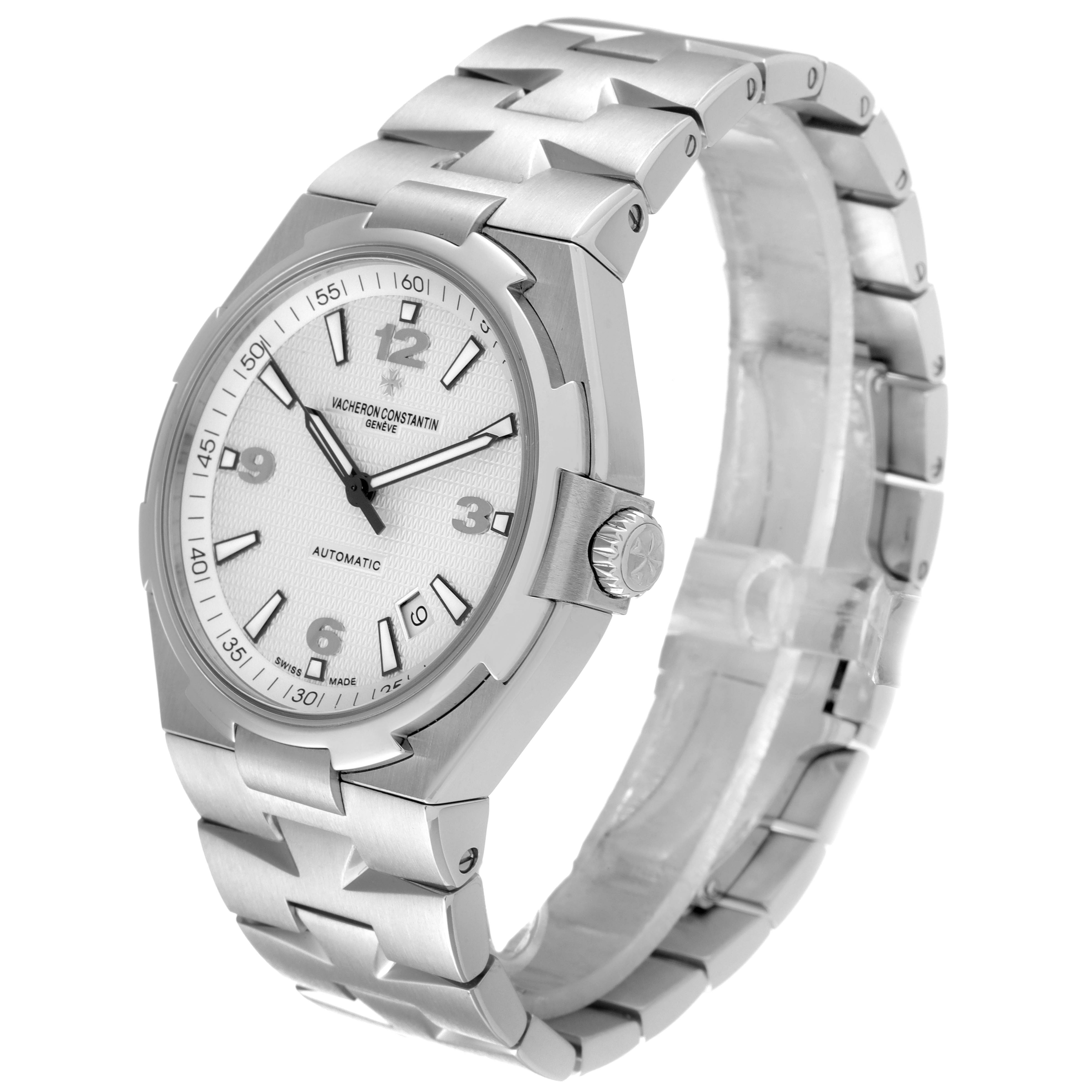 The image shows a three-quarter view of a Vacheron Constantin Overseas 47040B01A-9093 Men's Stainless Steel Silver Dial 47040B01A-9093 Men's Stainless Steel Silver Dial watch, highlighting its face, crown, and stainless steel bracelet.