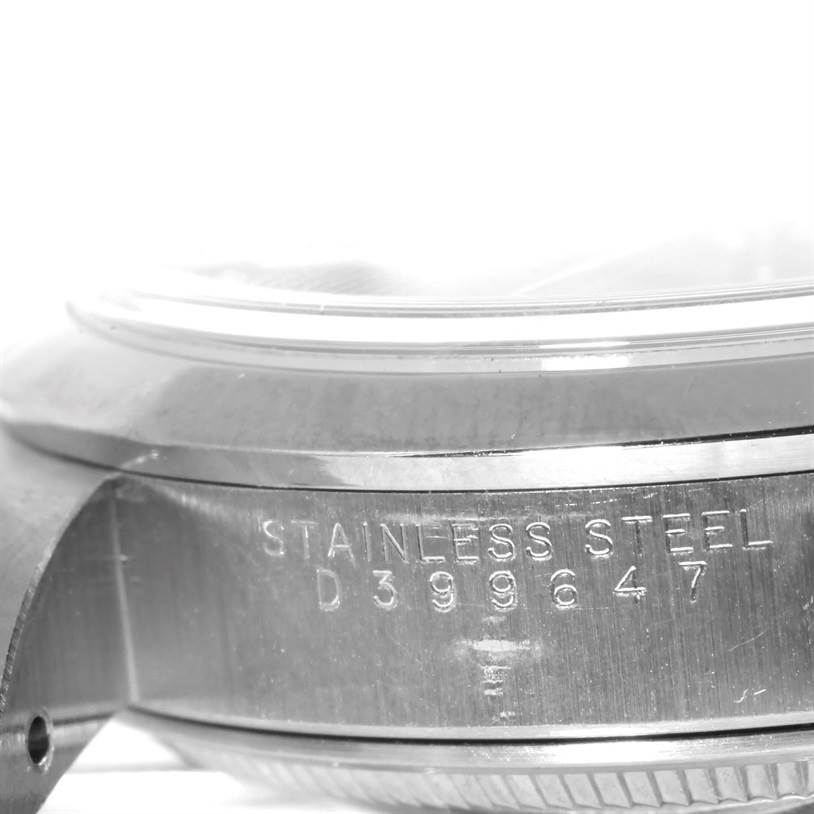 This image shows a close-up view of the casing and serial number engraving on the side of a Rolex Date 15200 Men's Stainless Steel Black Dial 15200 Men's Stainless Steel Black Dial model watch.