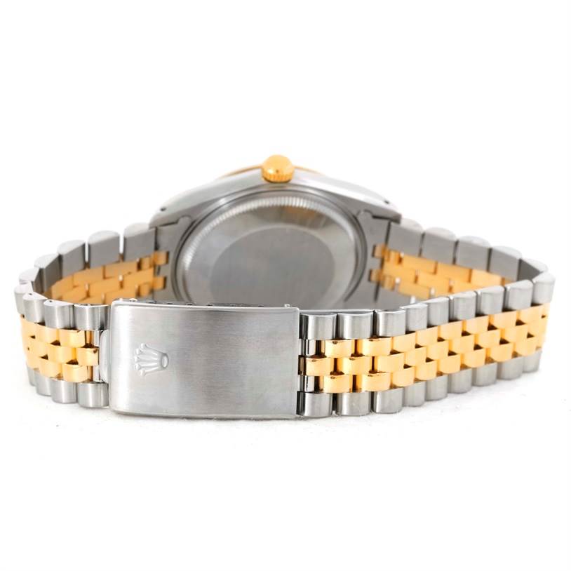 The image shows the back view of a Rolex Date 15053 Men's Steel and Gold (two tone) Champagne Dial 15053 Men's Steel and Gold (two tone) Champagne Dial model, highlighting the case back and two-tone metal bracelet with a clasp.