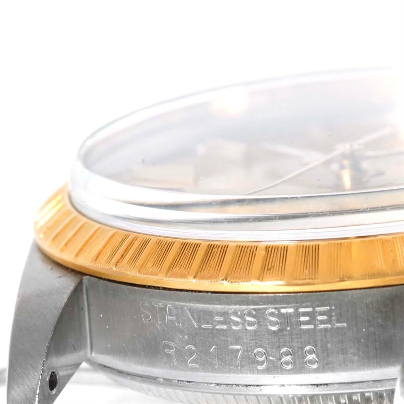 This close-up angle shows the side of the stainless steel case and the fluted bezel of the Rolex Date 15053 Men's Steel and Gold (two tone) Champagne Dial 15053 Men's Steel and Gold (two tone) Champagne Dial watch.