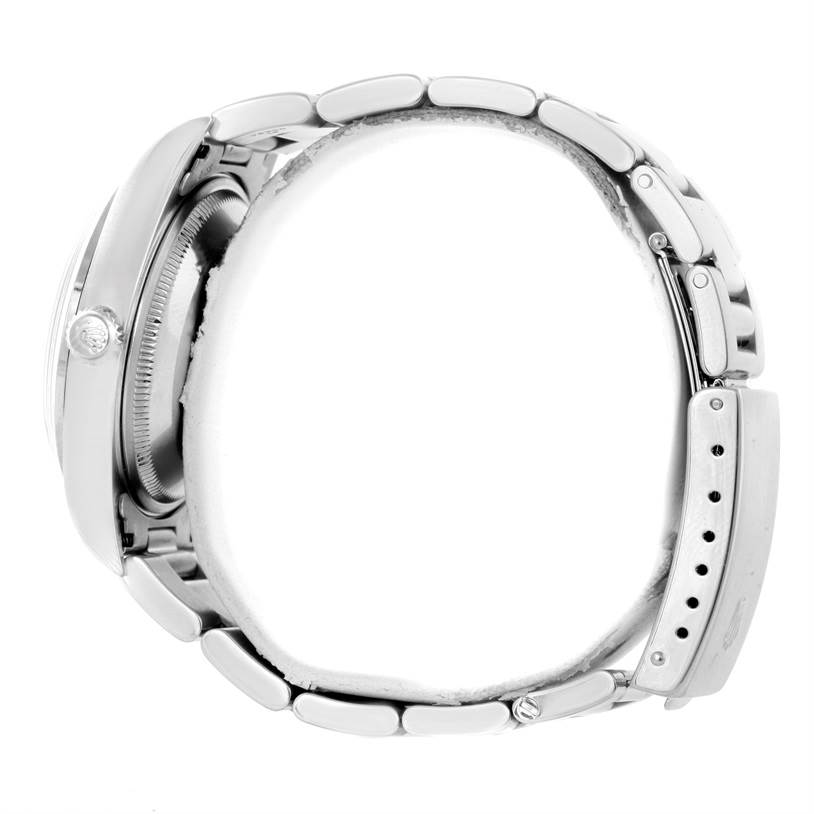 This image shows a side view of a Rolex Date 15200 Men's Stainless Steel Pink Dial 15200 Men's Stainless Steel Pink Dial model watch, highlighting its case, crown, and linked bracelet.