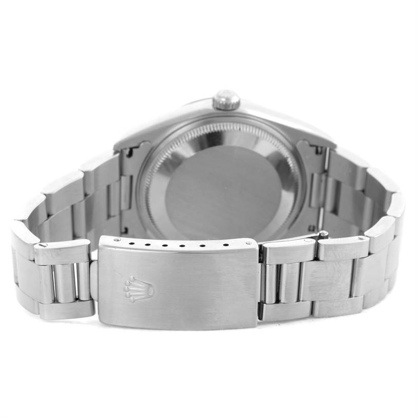 The image shows the back of the Rolex Date 15200 Men's Stainless Steel Pink Dial 15200 Men's Stainless Steel Pink Dial model watch, highlighting the closed clasp and part of the bracelet.