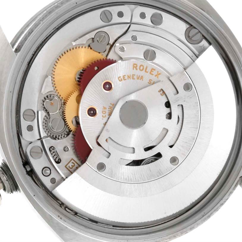 This image shows a close-up view of the movement mechanism of a Rolex Date 115200 Men's Stainless Steel Black Dial 115200 Men's Stainless Steel Black Dial model watch.