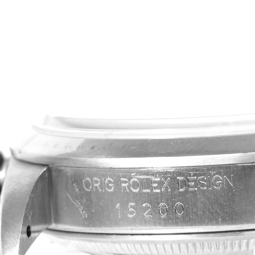 This image shows a close-up of the side of a Rolex Date 15200 Men's Stainless Steel Silver Dial 15200 Men's Stainless Steel Silver Dial model, highlighting the "ORIG ROLEX DESIGN" and model number 15200 engraving.