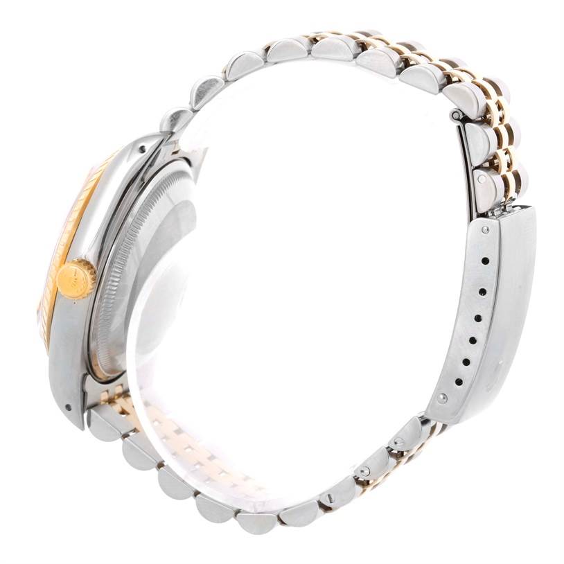 This image shows the side view of a Rolex Date 15223 Men's Steel and Gold (two tone) Champagne Dial 15223 Men's Steel and Gold (two tone) Champagne Dial model watch, focusing on the bracelet and crown.