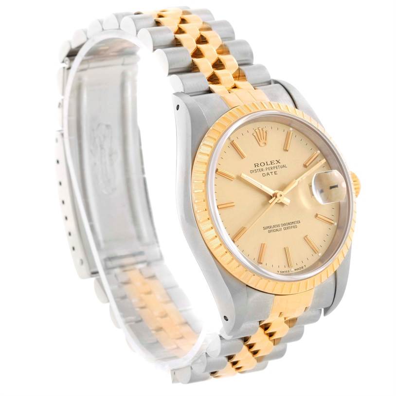 The image shows a Rolex Date 15223 Men's Steel and Gold (two tone) Champagne Dial 15223 Men's Steel and Gold (two tone) Champagne Dial model from an angled side view, highlighting its two-tone bracelet, gold bezel, and champagne dial.