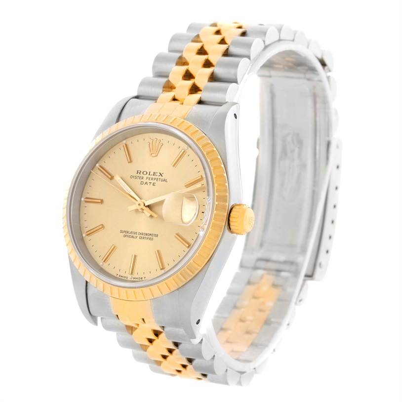 This image shows a Rolex Date 15223 Men's Steel and Gold (two tone) Champagne Dial 15223 Men's Steel and Gold (two tone) Champagne Dial model watch angled to display the dial, bezel, and bracelet.